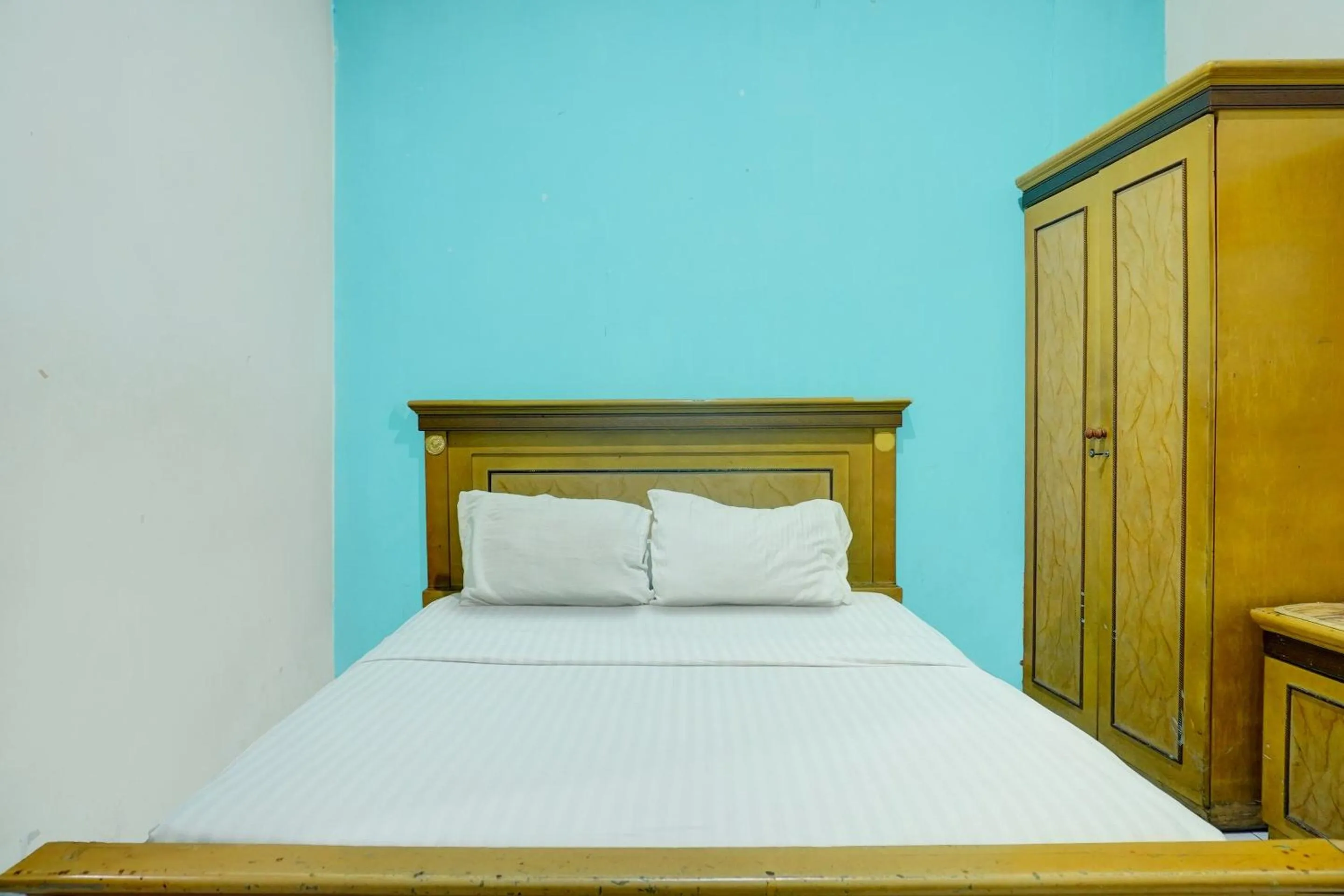 Bedroom in Hotel O Ervina Homestay Syariah Batakan