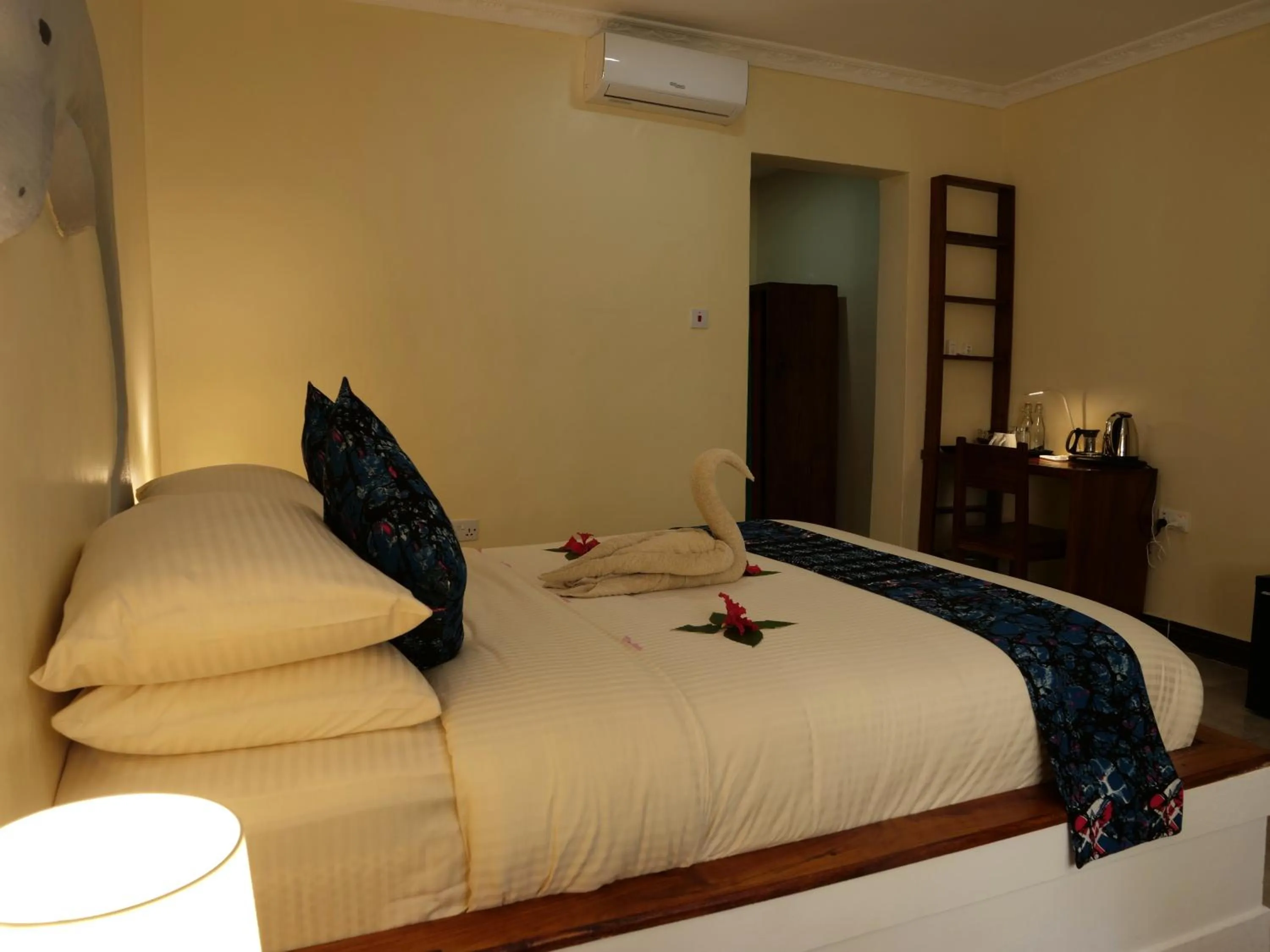 Bed in Double A Nungwi Beach Hotel