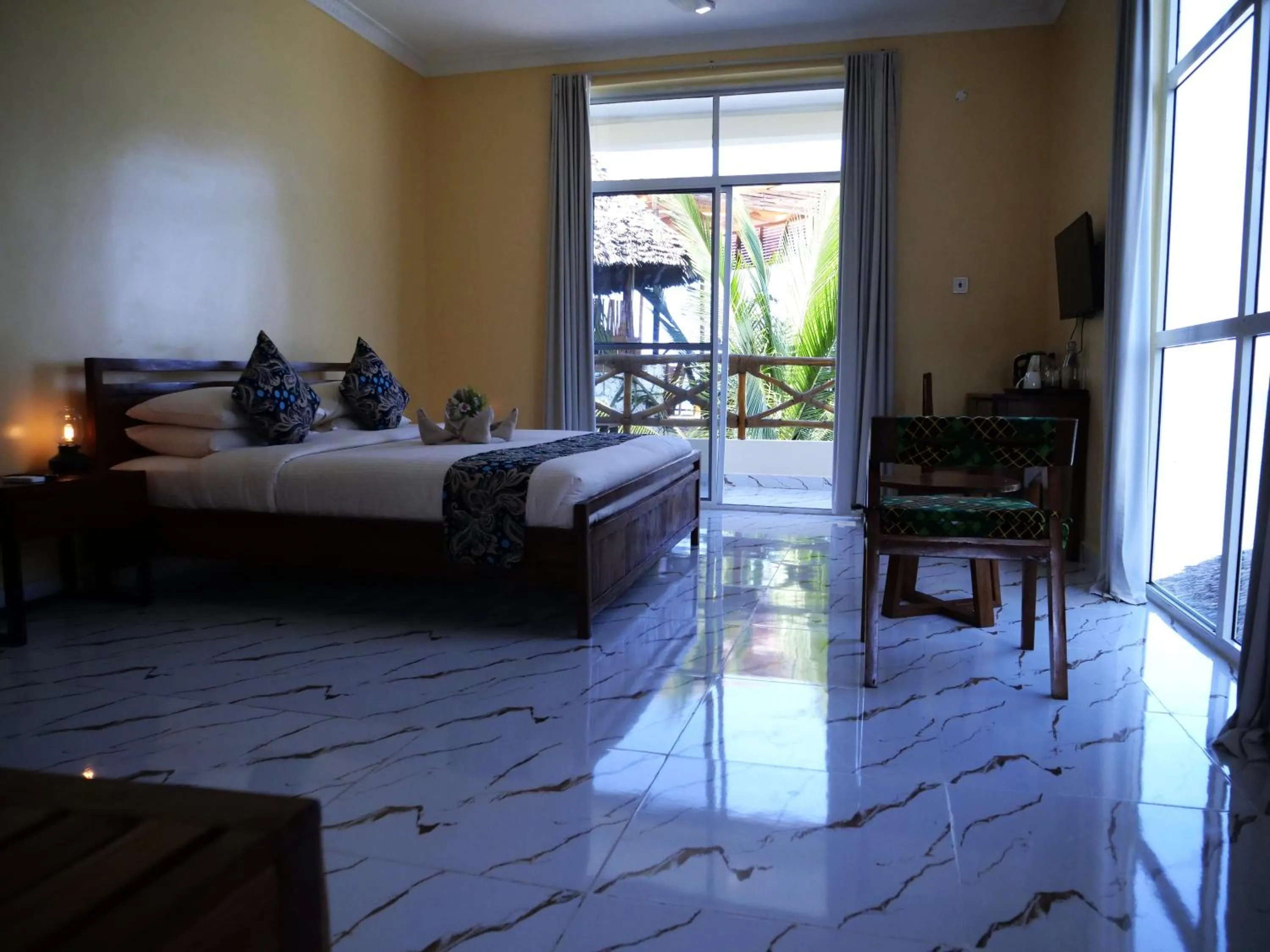 Bed in Double A Nungwi Beach Hotel