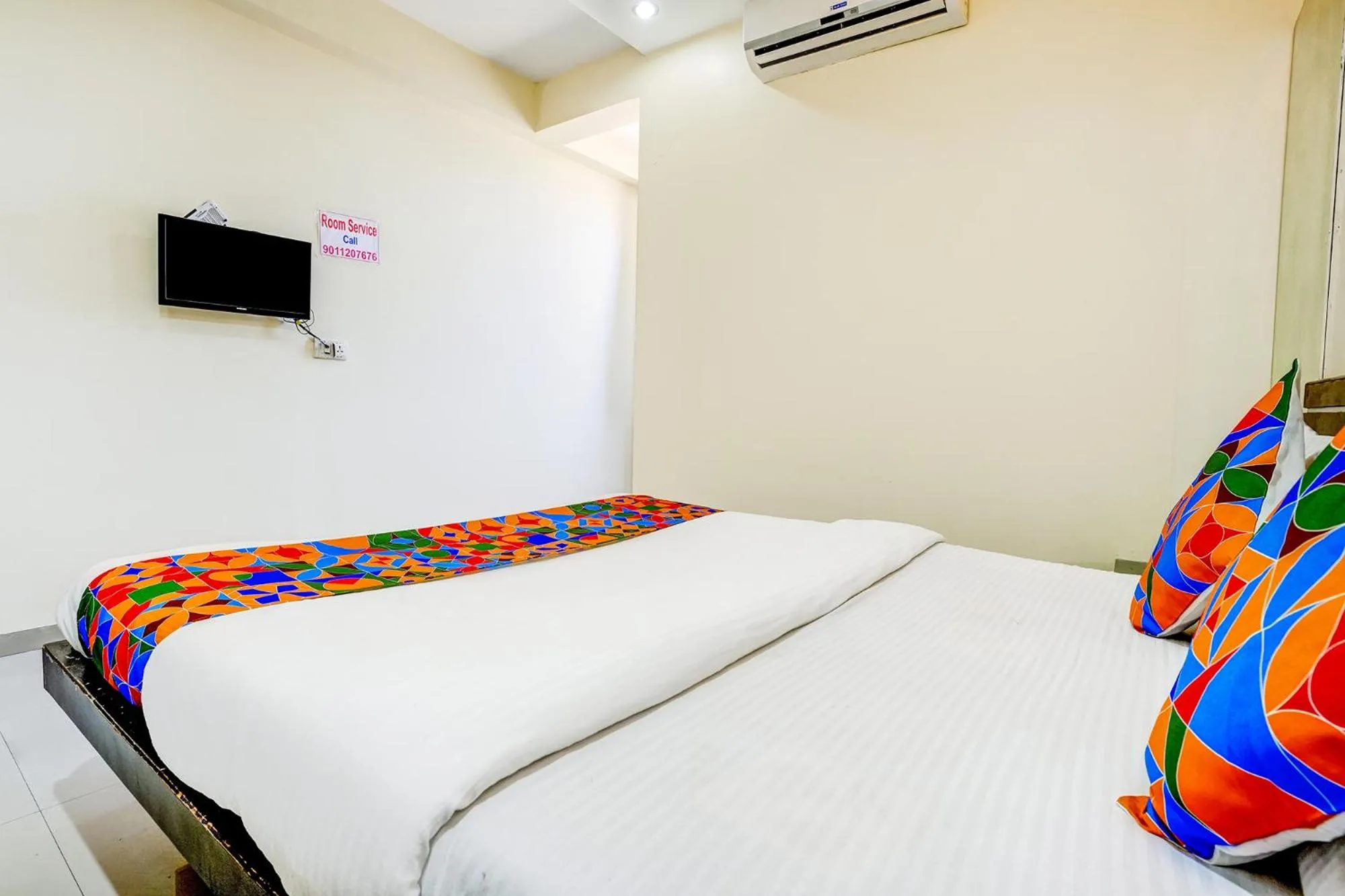 Communal lounge/ TV room, Bed in FabHotel Sai Govind