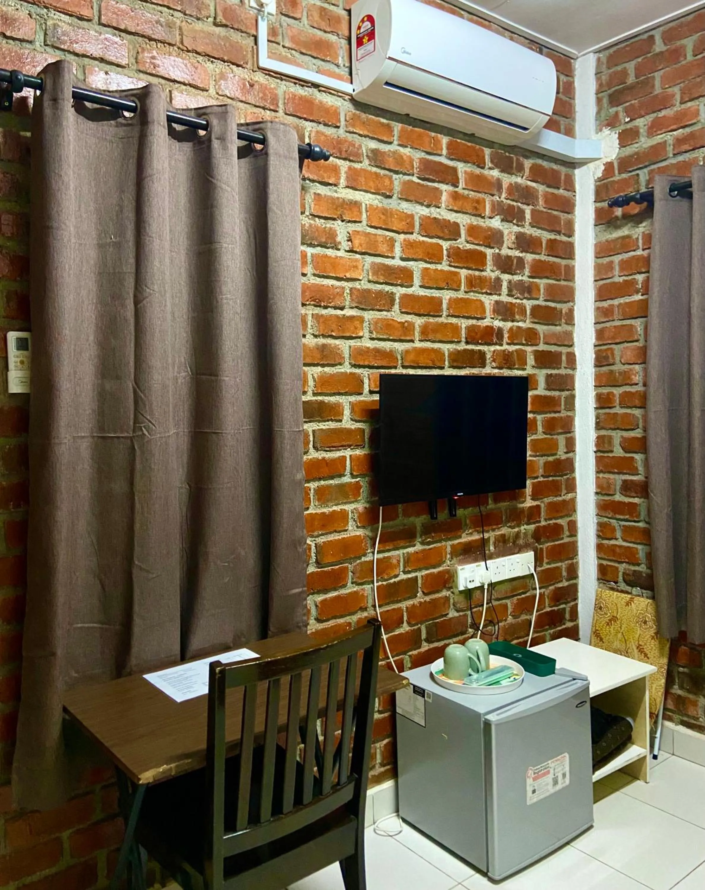 Communal lounge/ TV room in Padang Besar Green Inn