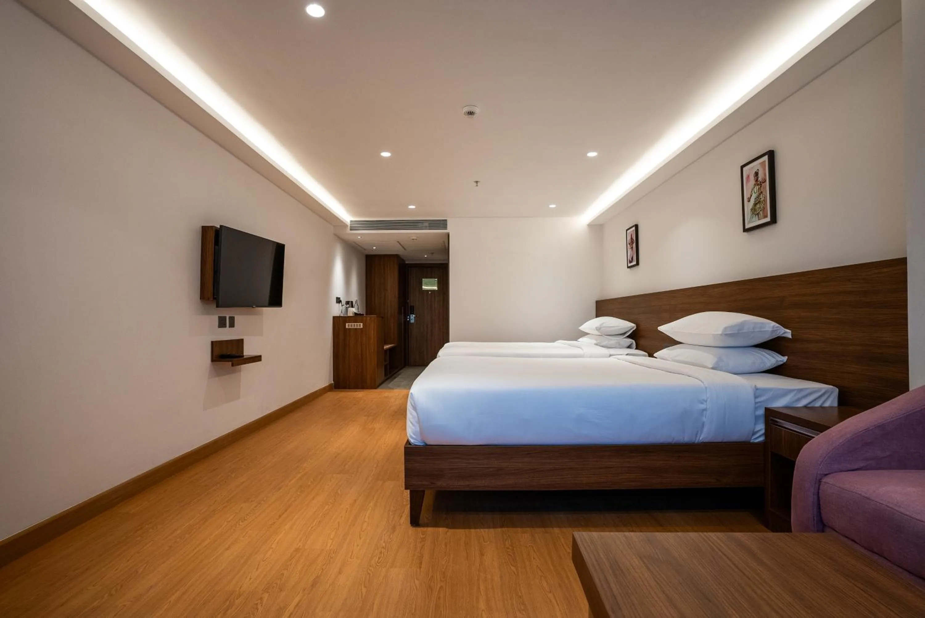 Bed in Lilac Hotel Guruvayur