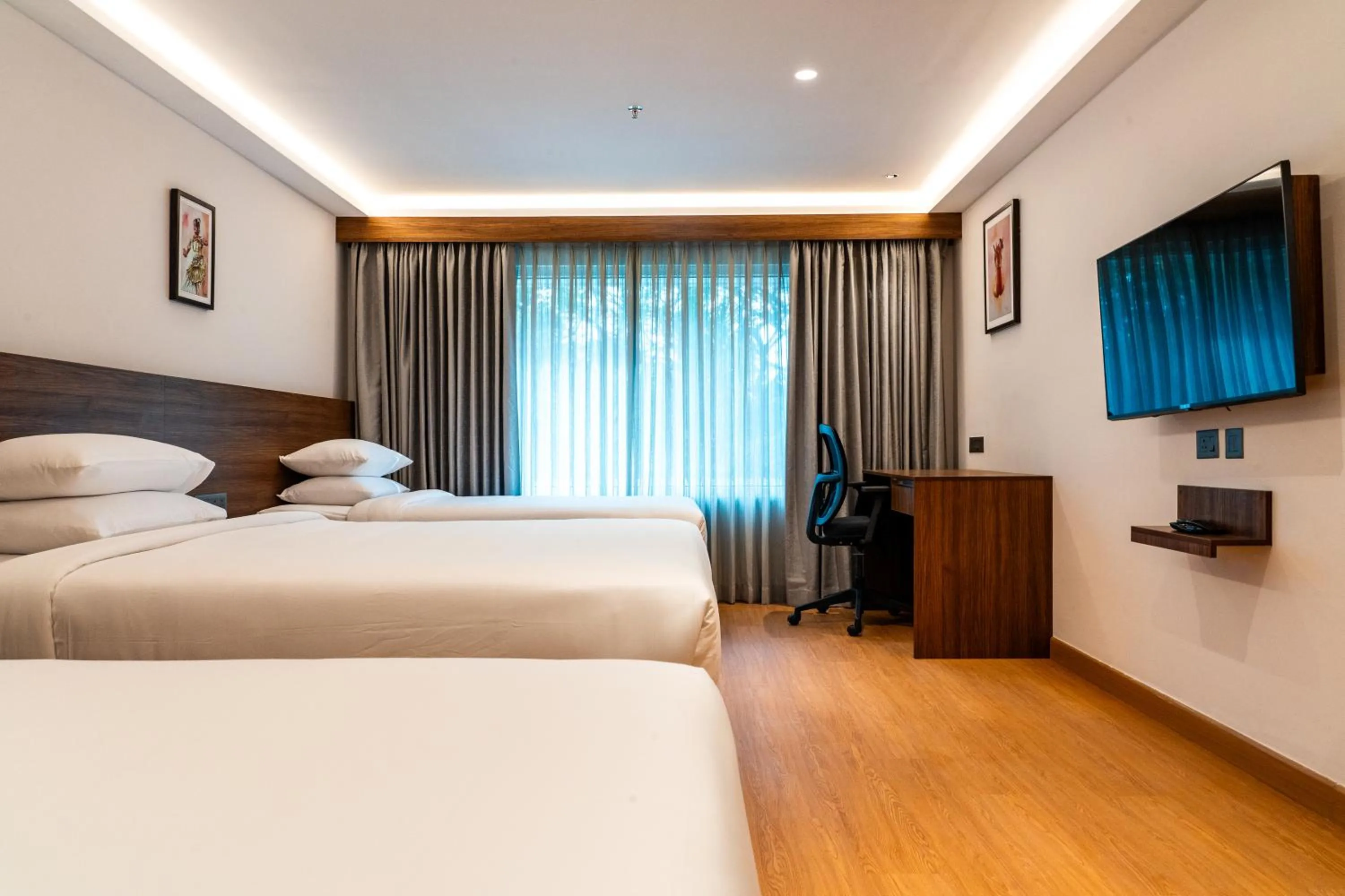 Bed in Lilac Hotel Guruvayur