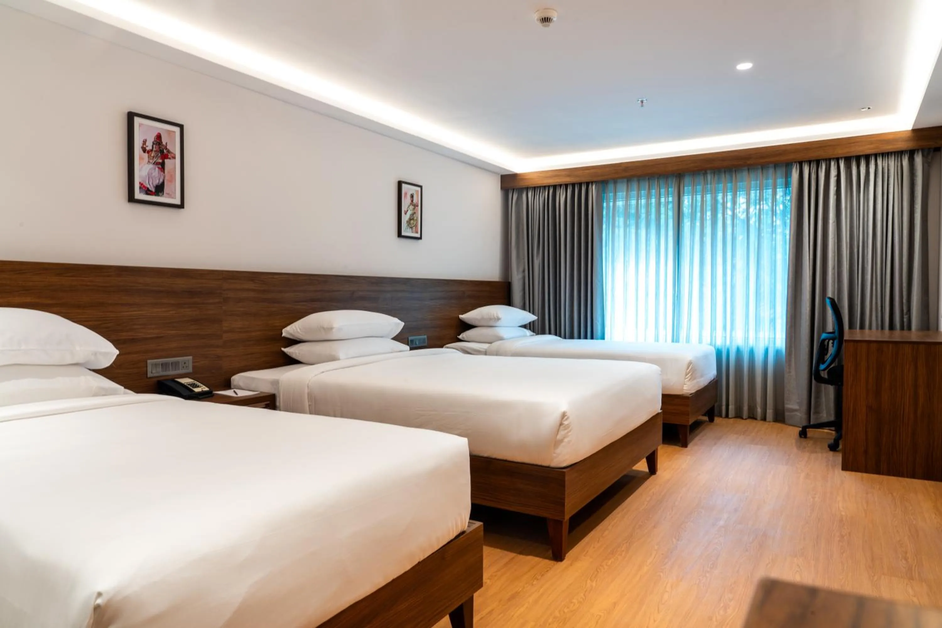 Bed in Lilac Hotel Guruvayur