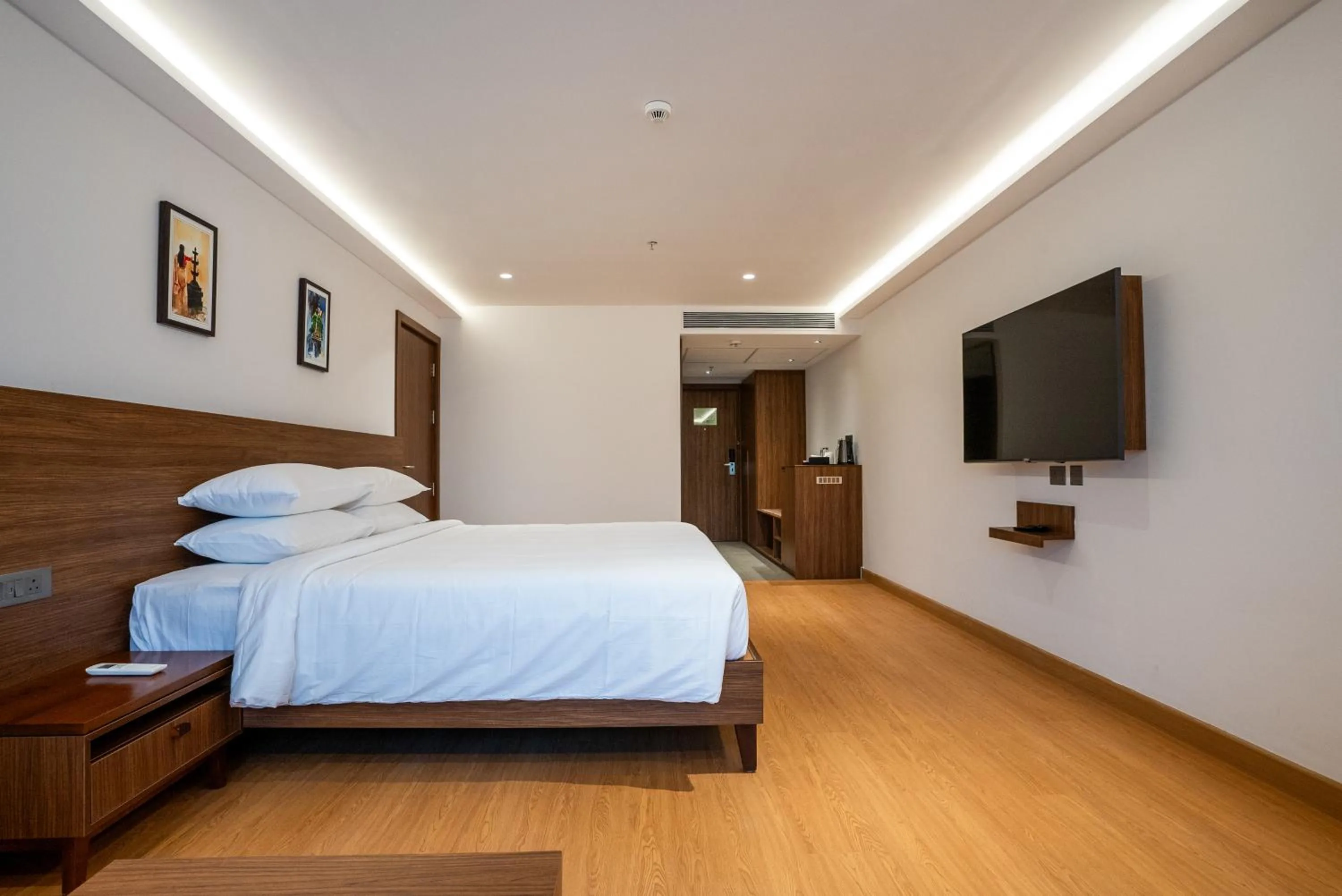 Bed in Lilac Hotel Guruvayur