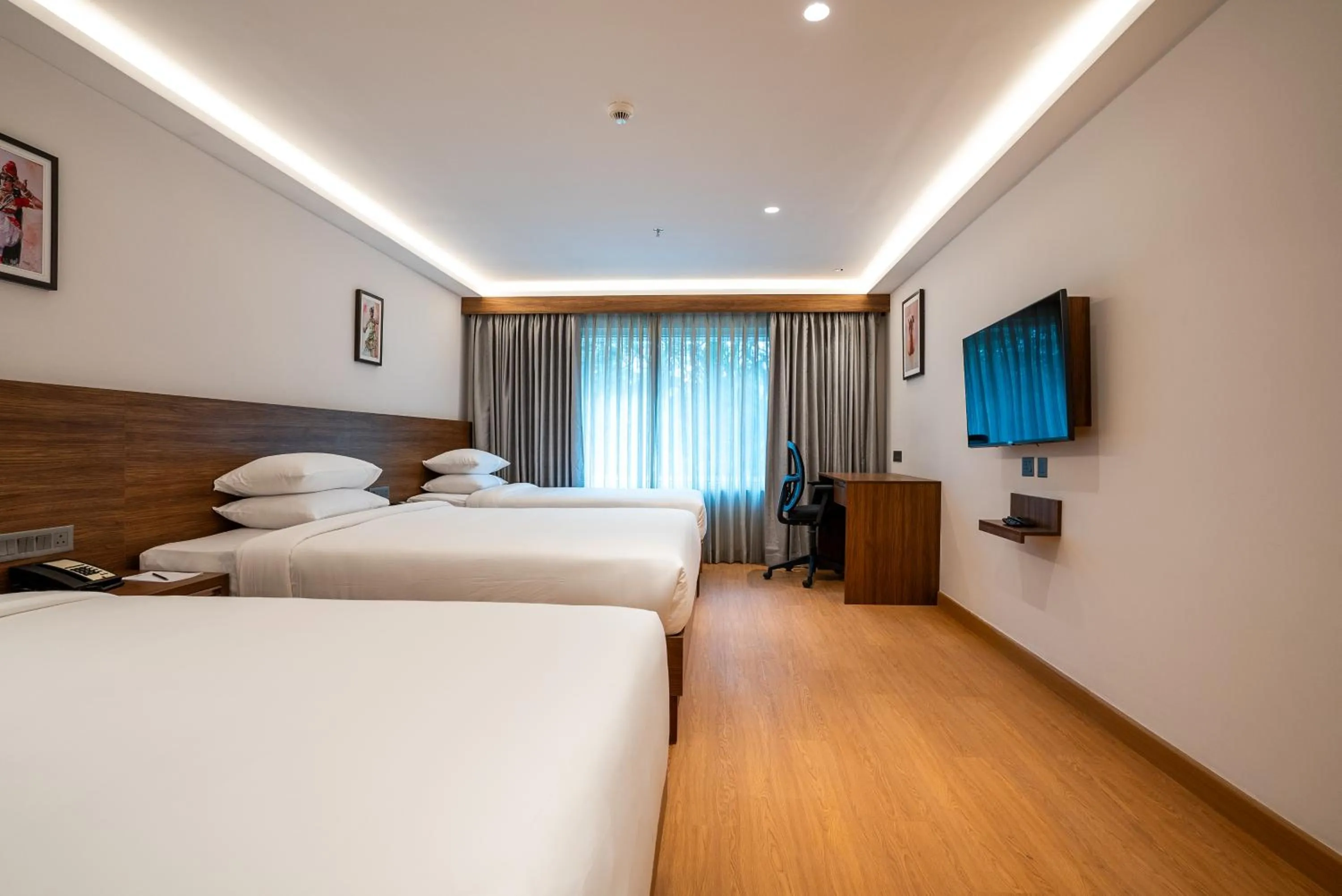 Bed in Lilac Hotel Guruvayur