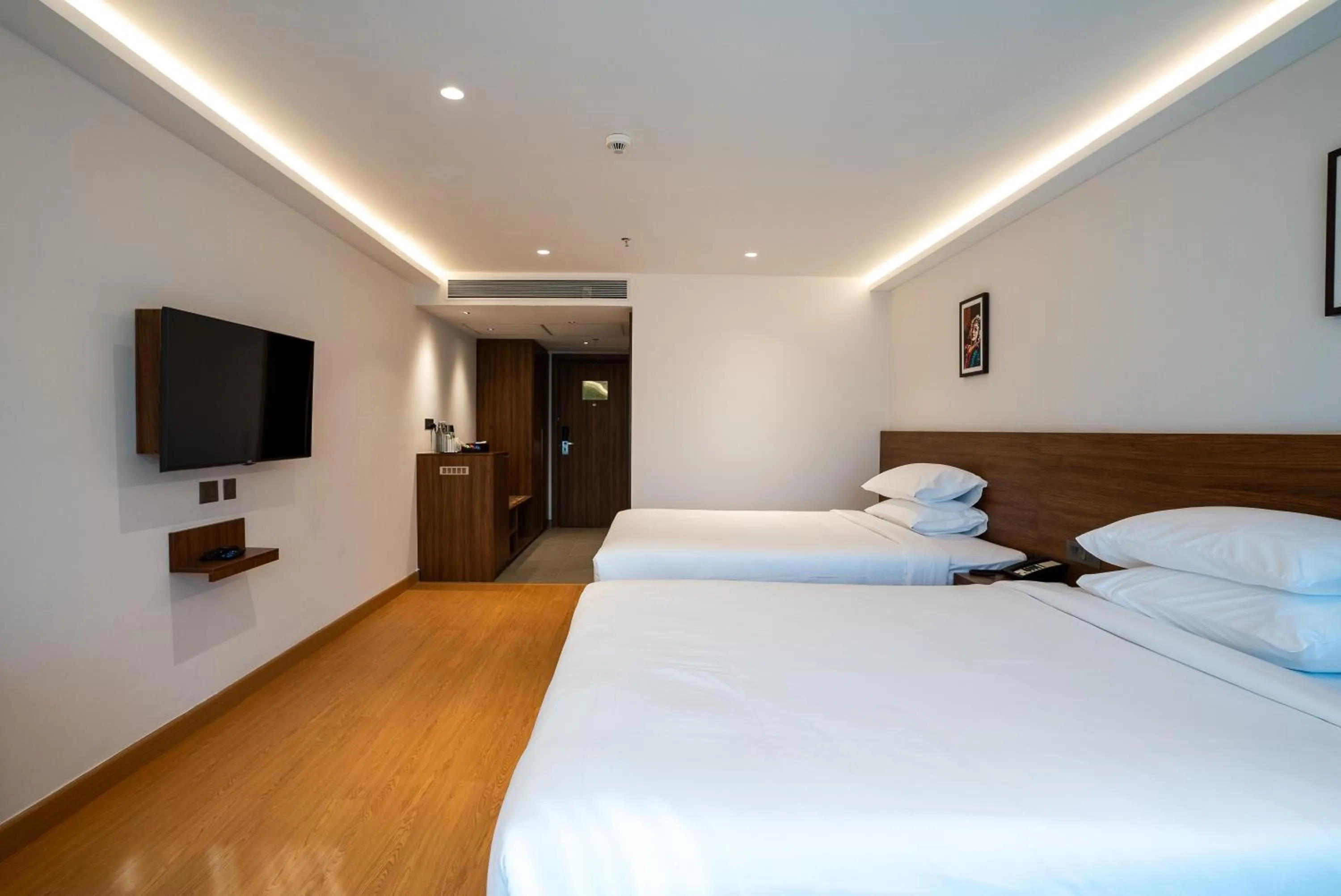 Bed in Lilac Hotel Guruvayur