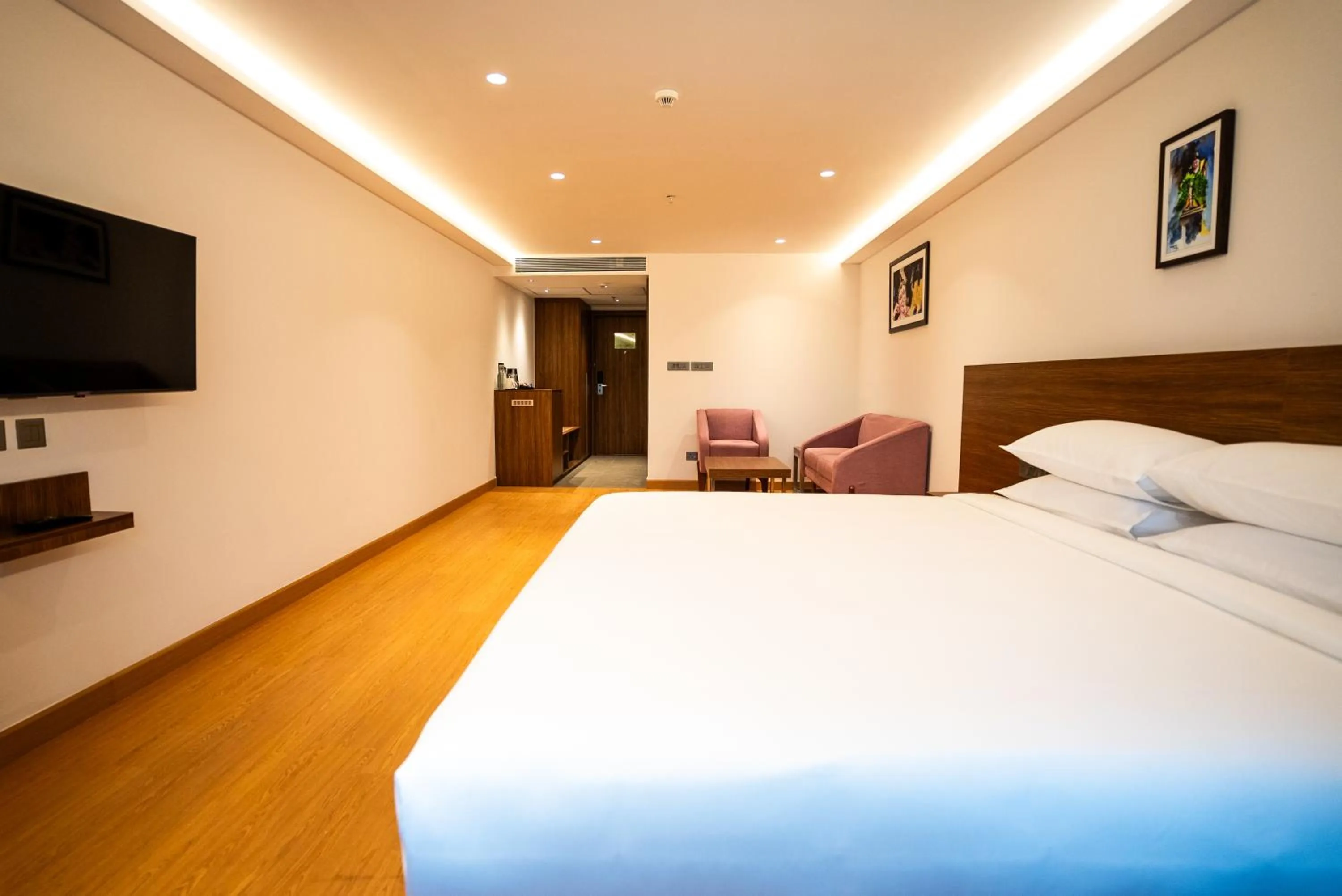 Bed in Lilac Hotel Guruvayur