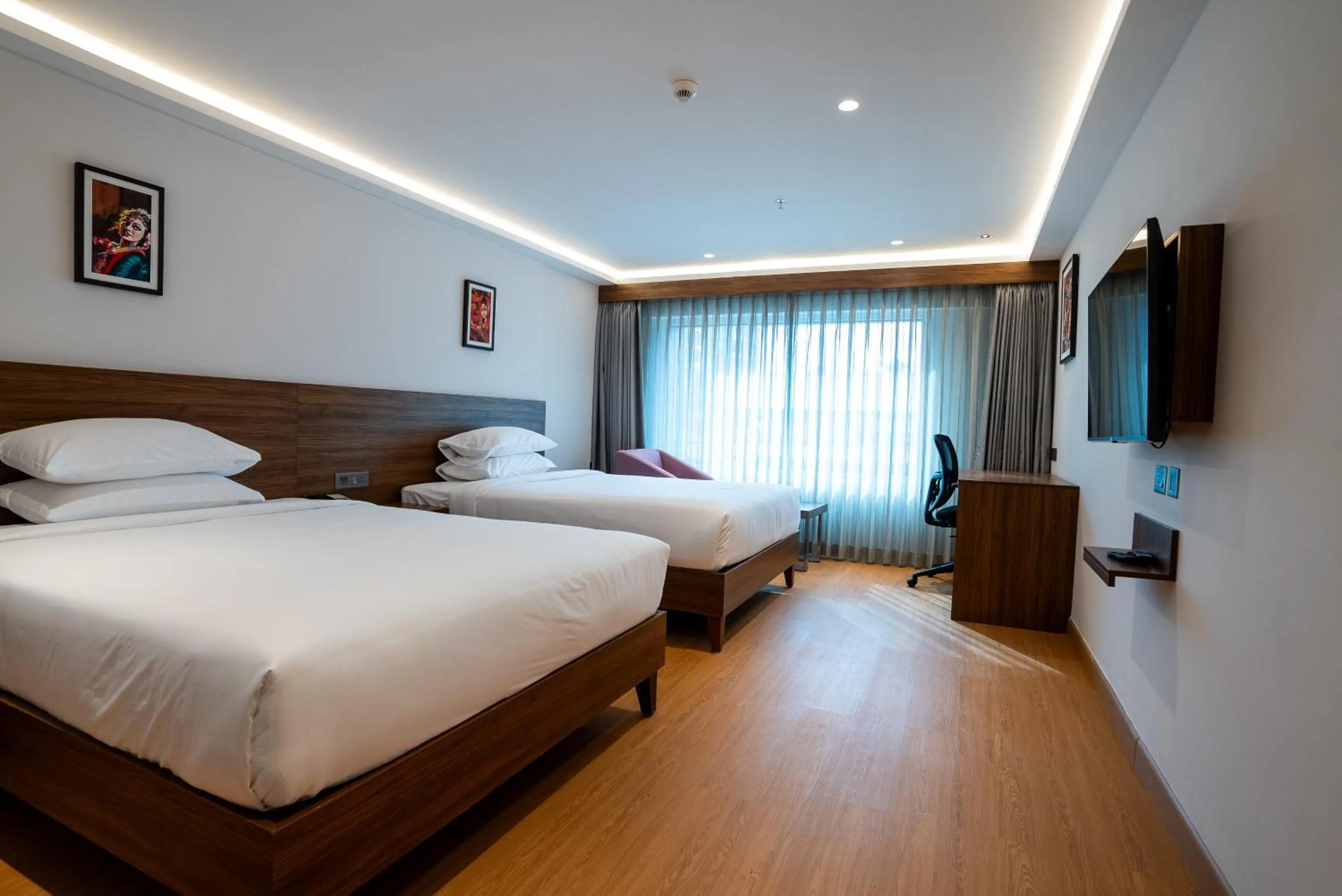 Bed in Lilac Hotel Guruvayur