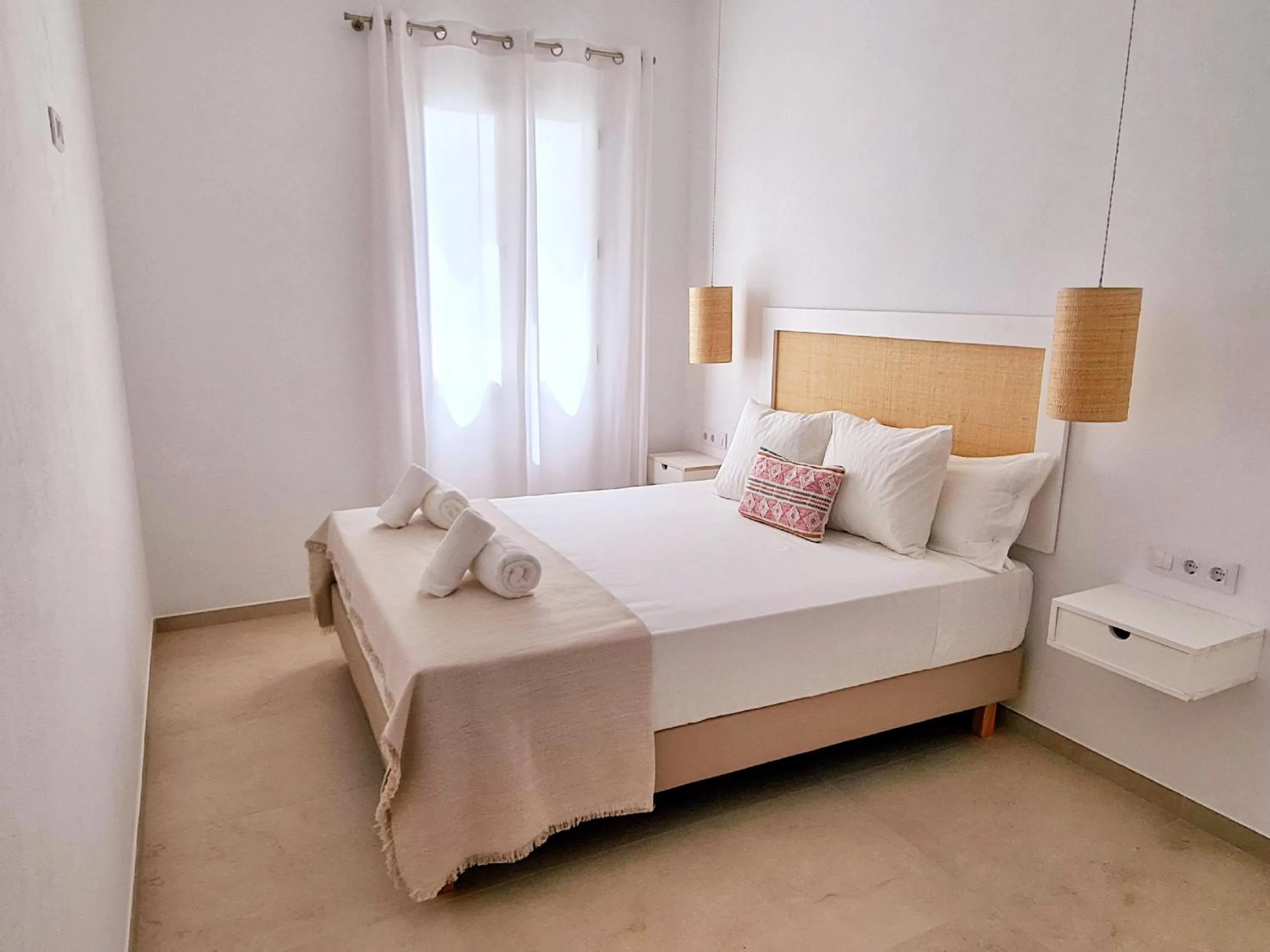 Bed in Waki Conscious Hotel