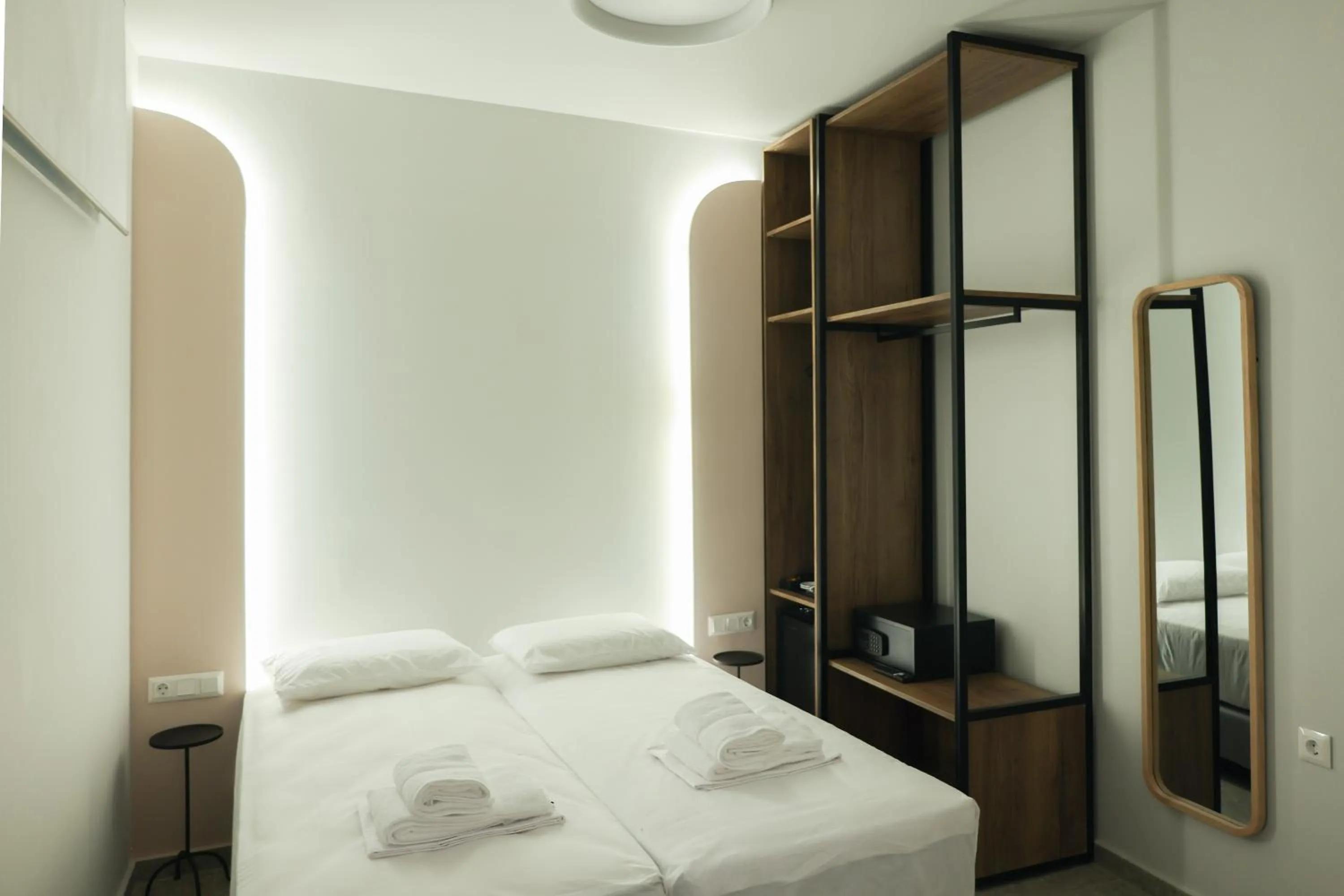 Bed in Uphill Unique Boutique Suites