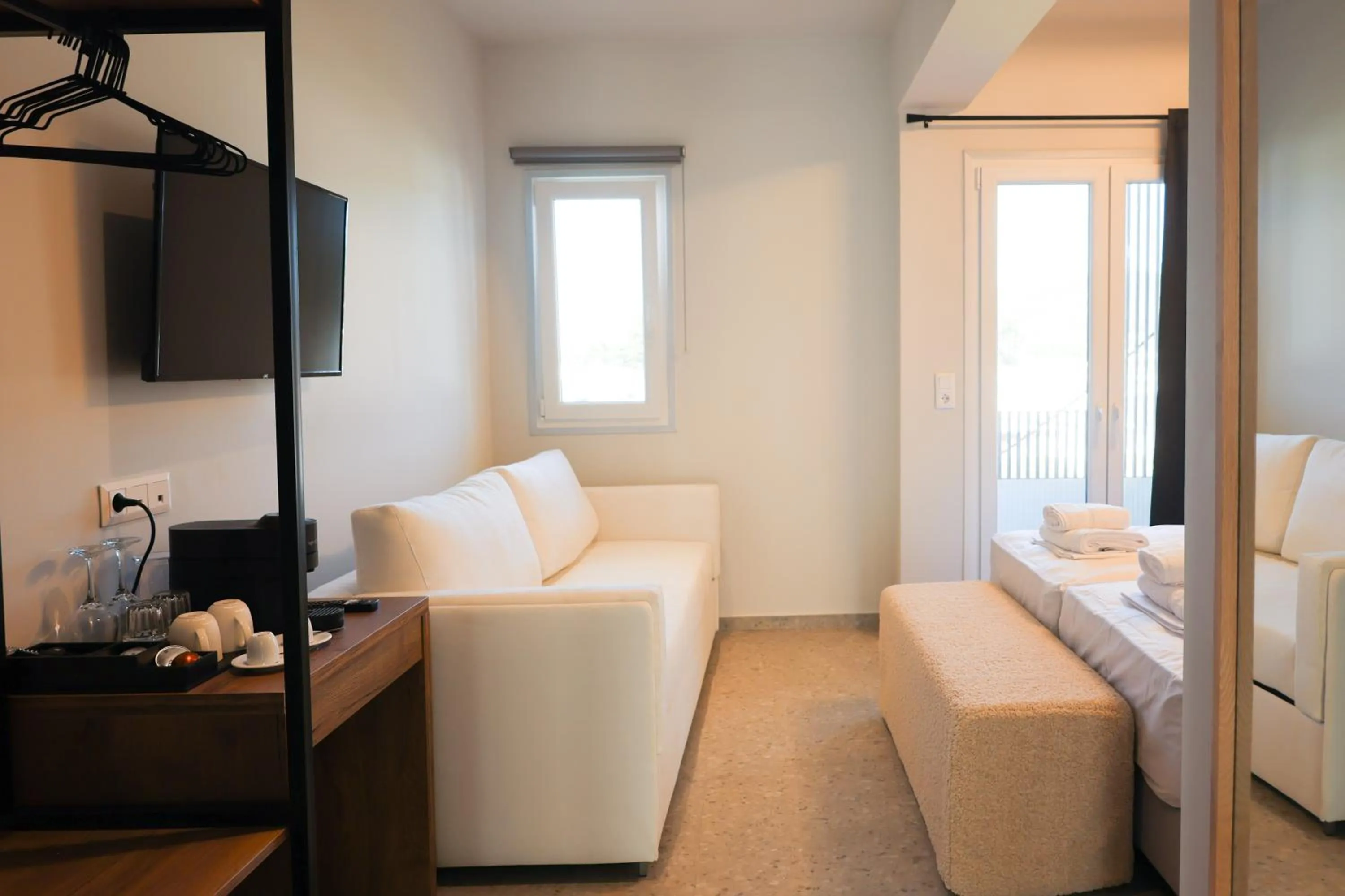 Living room, Bed in Uphill Unique Boutique Suites