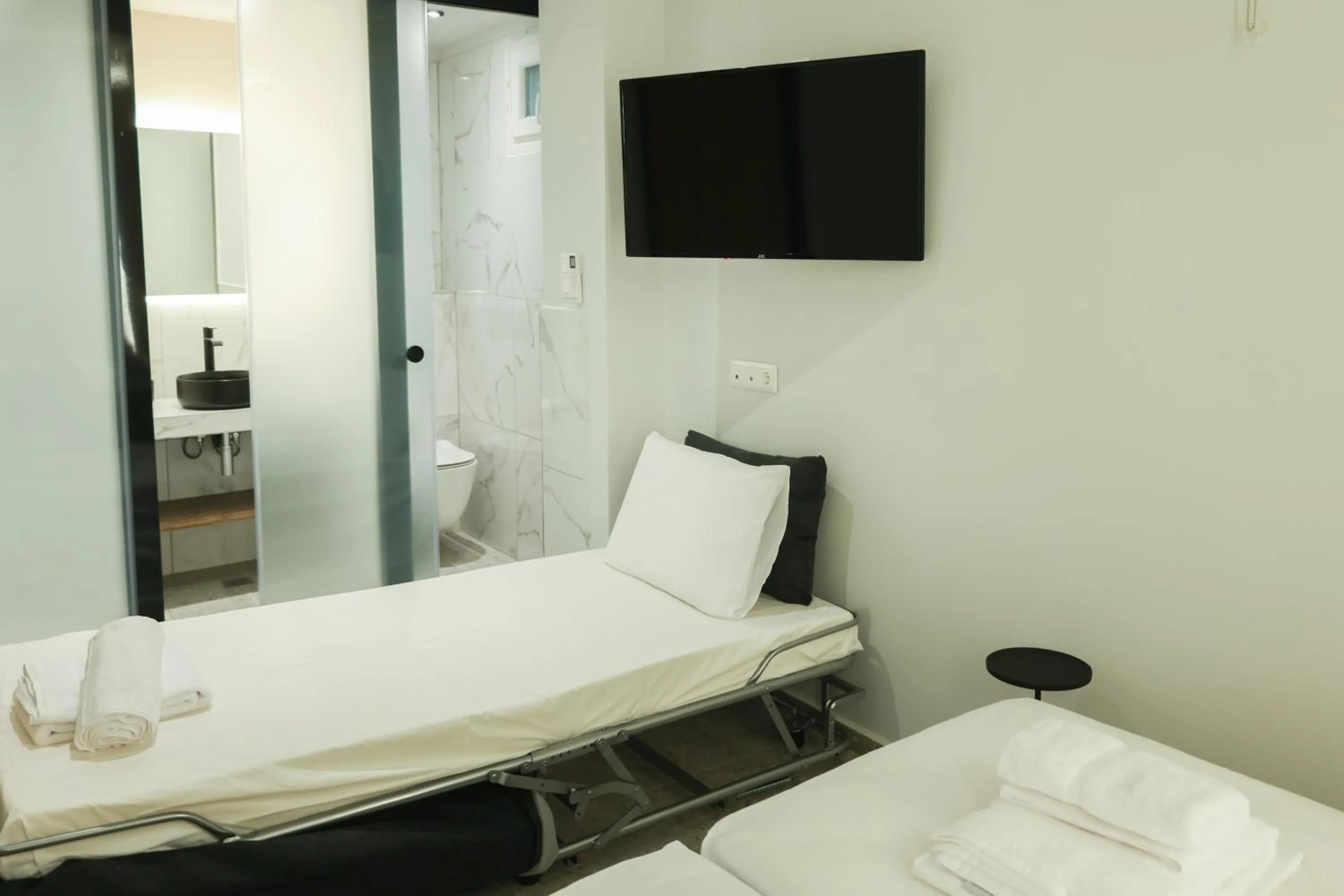 Bed in Uphill Unique Boutique Suites