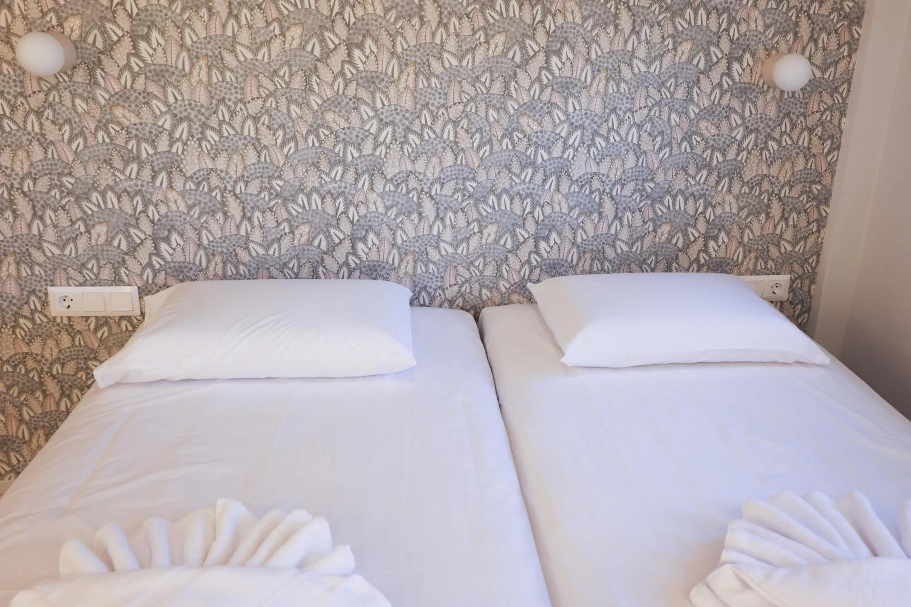 Bed in Uphill Unique Boutique Suites