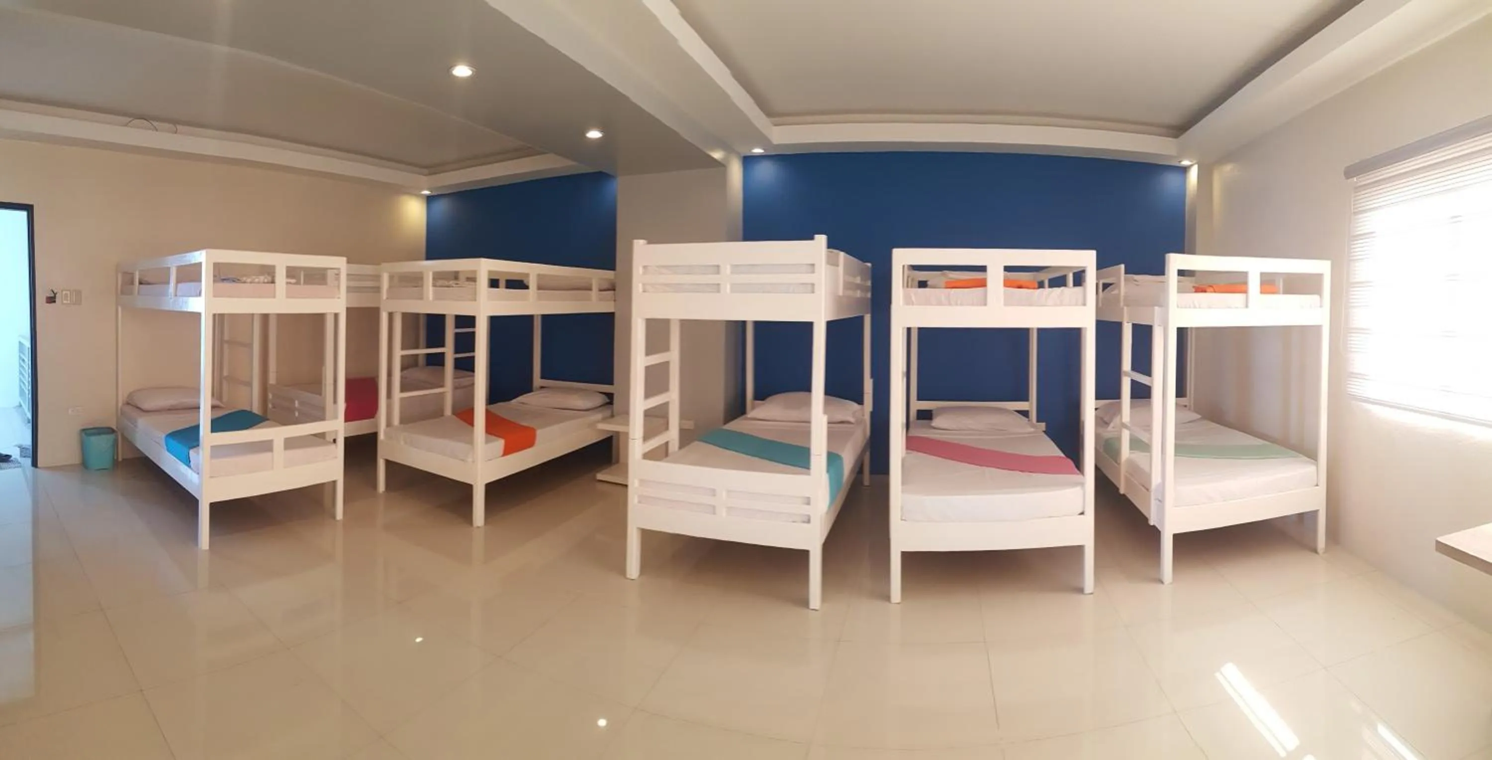 Bed in Blue Coast Beach Hotel