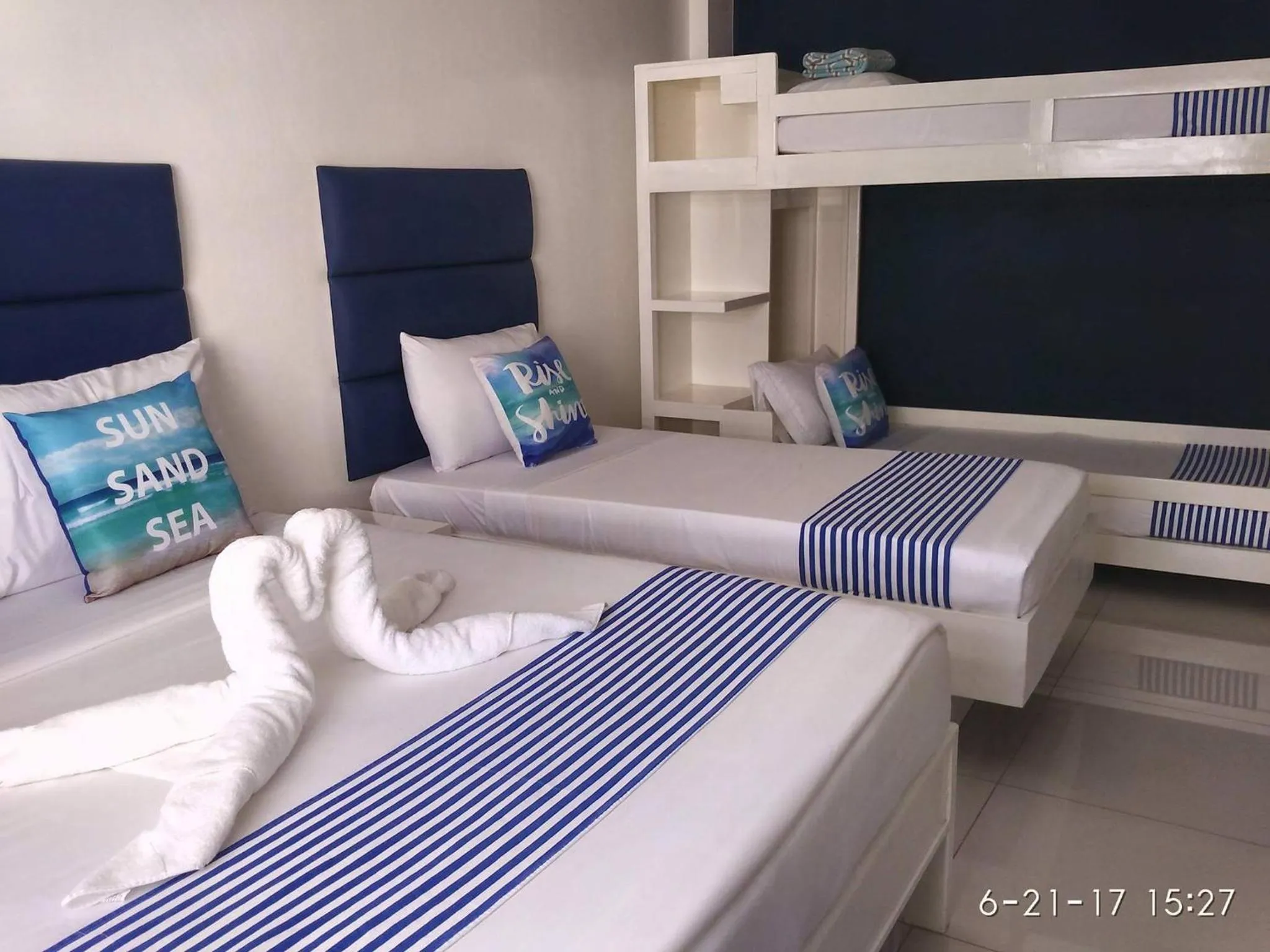 Bed in Blue Coast Beach Hotel