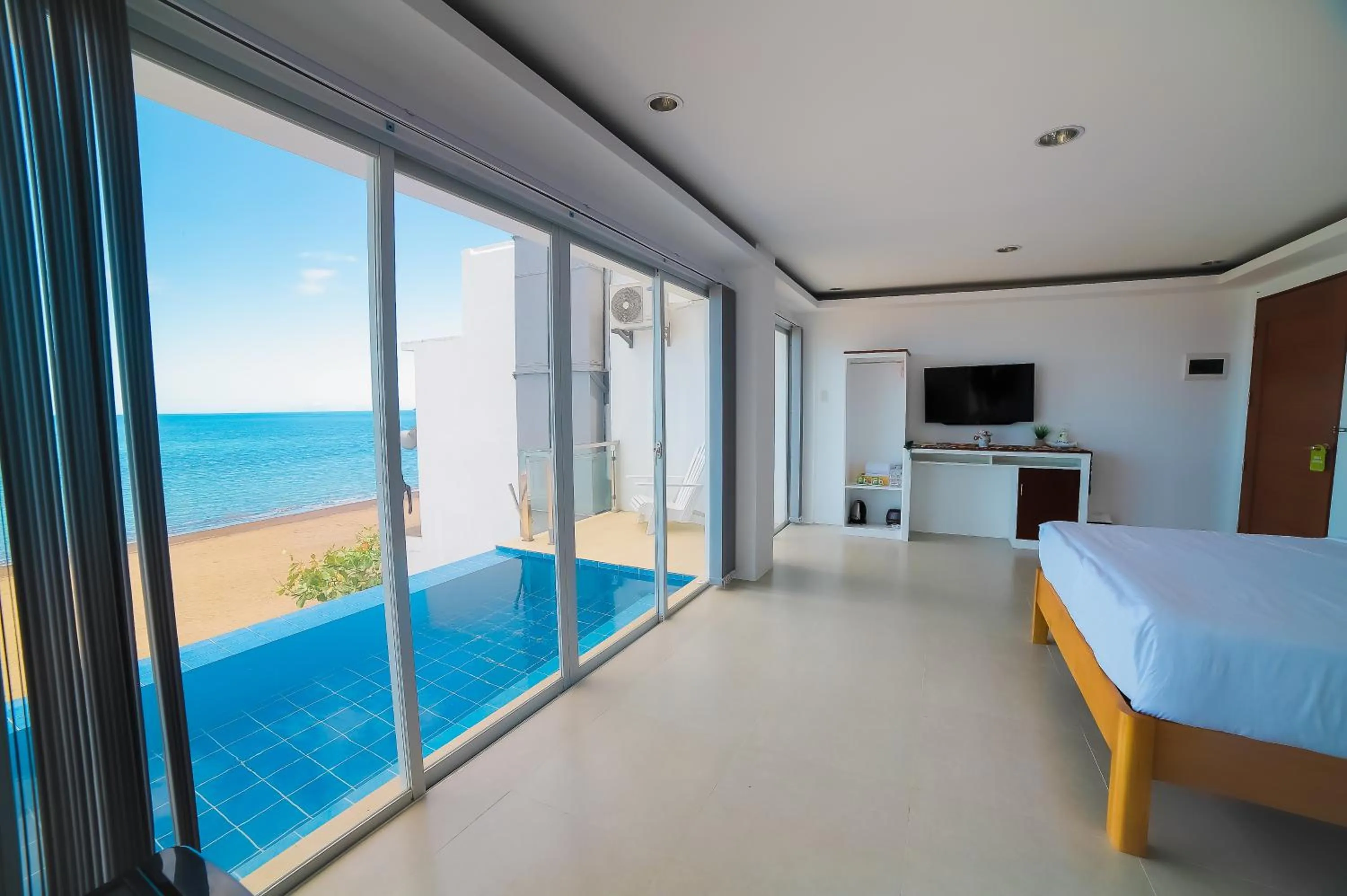 Bed in Blue Coast Beach Hotel