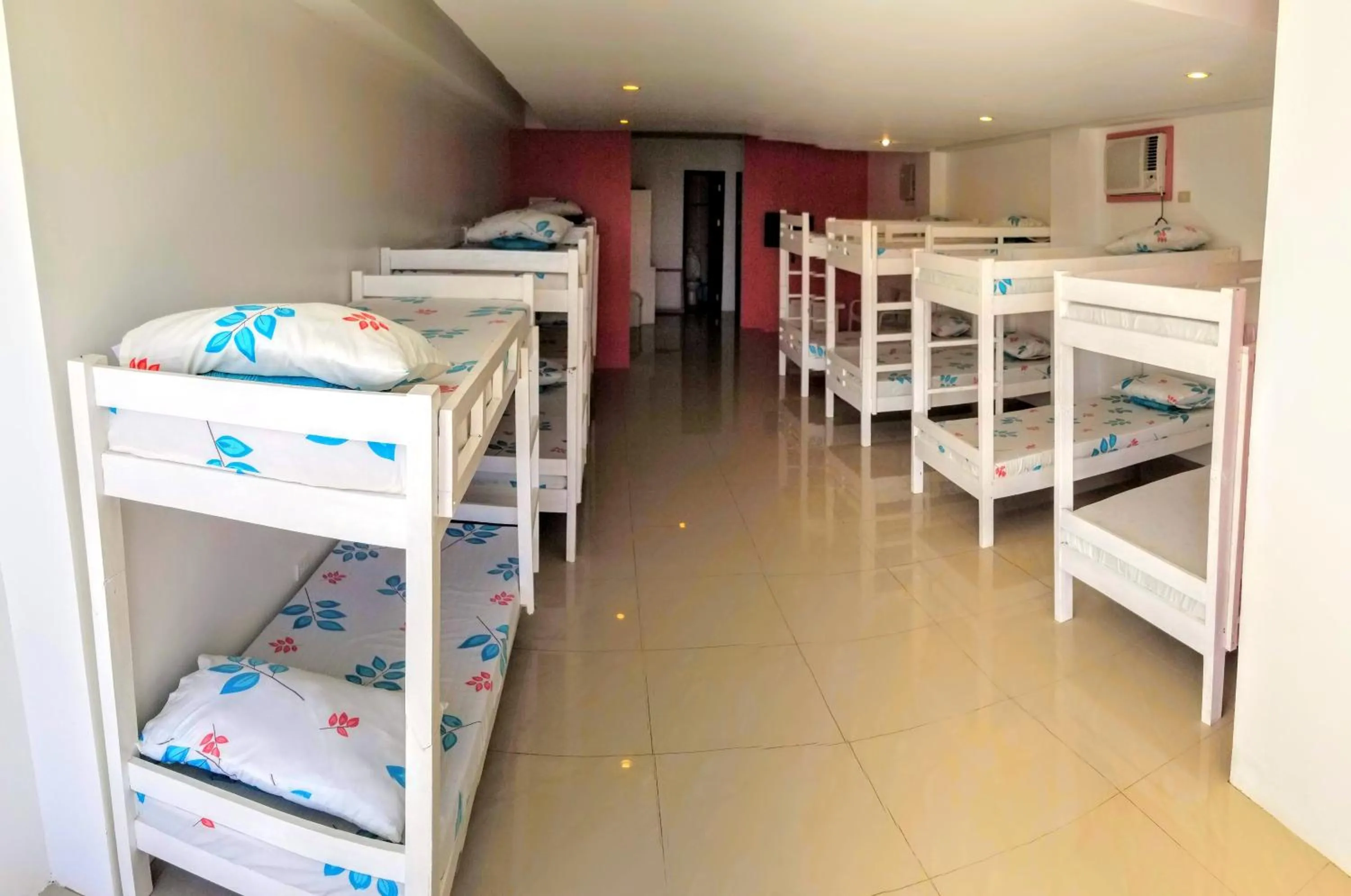 Bed in Blue Coast Beach Hotel