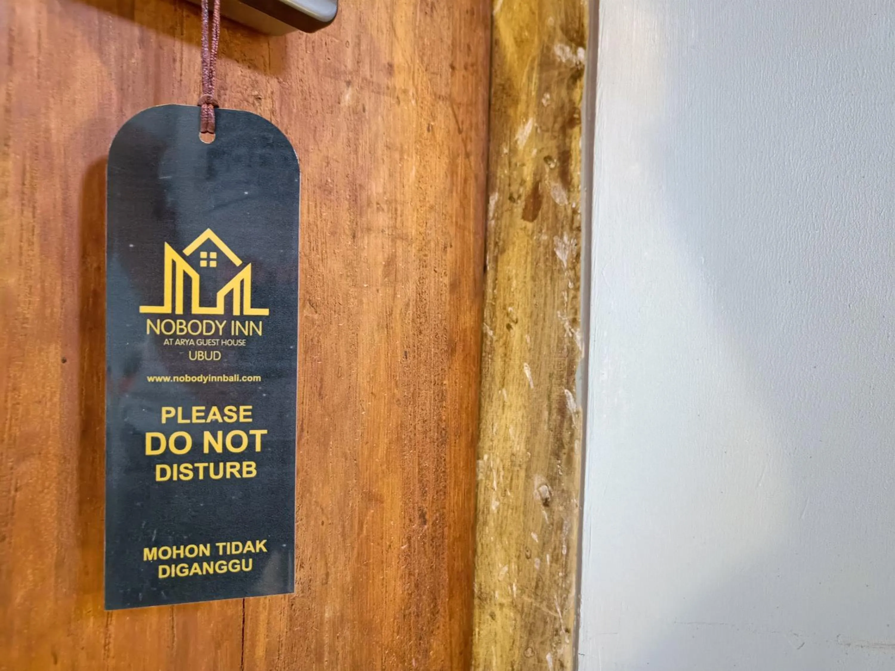 Property logo or sign in Nobody Inn Bali at Arya guest house