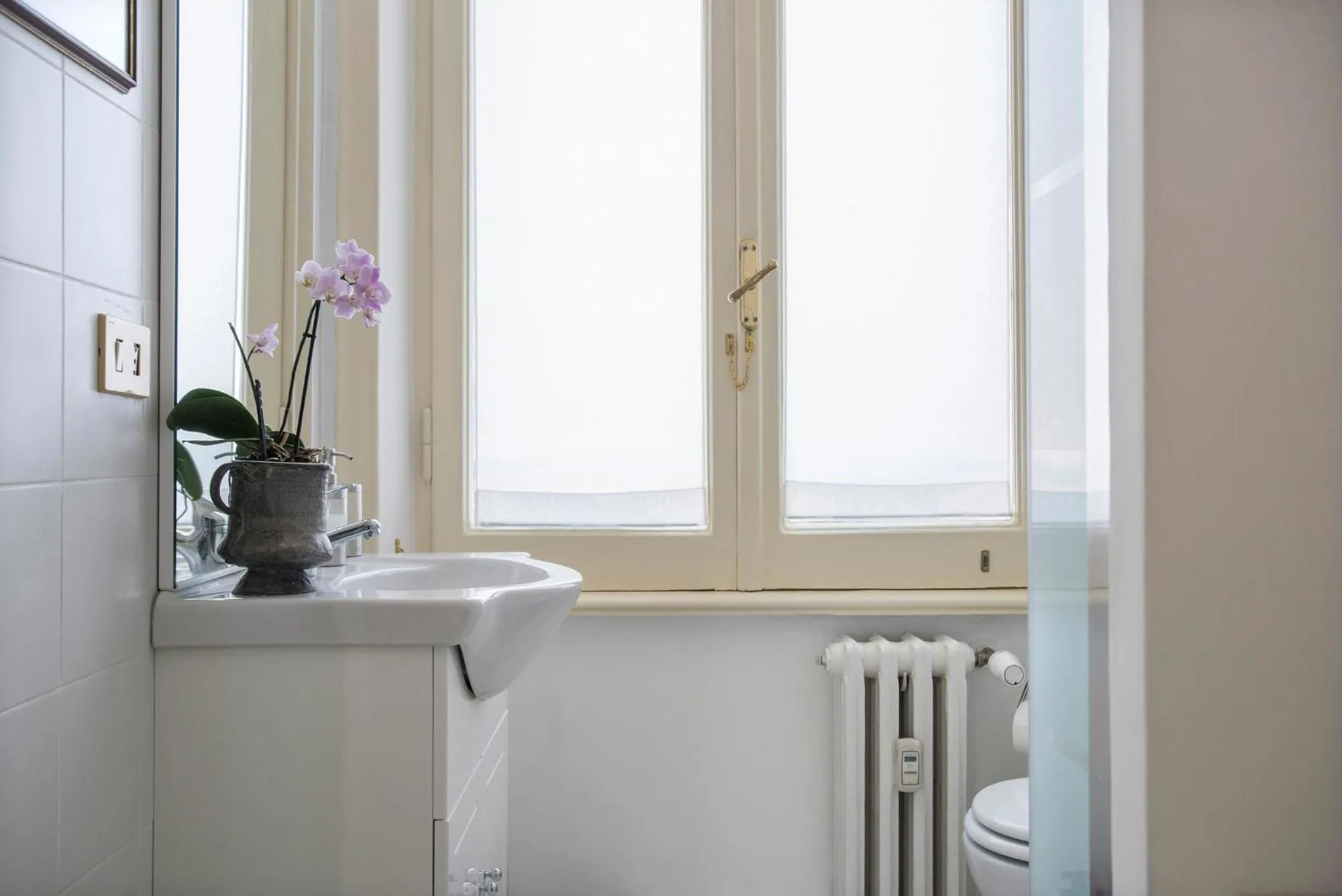 Bathroom in ""Bright Top Floor Apartment Vatican & Tiber View, Steps from Olympic Stadium"