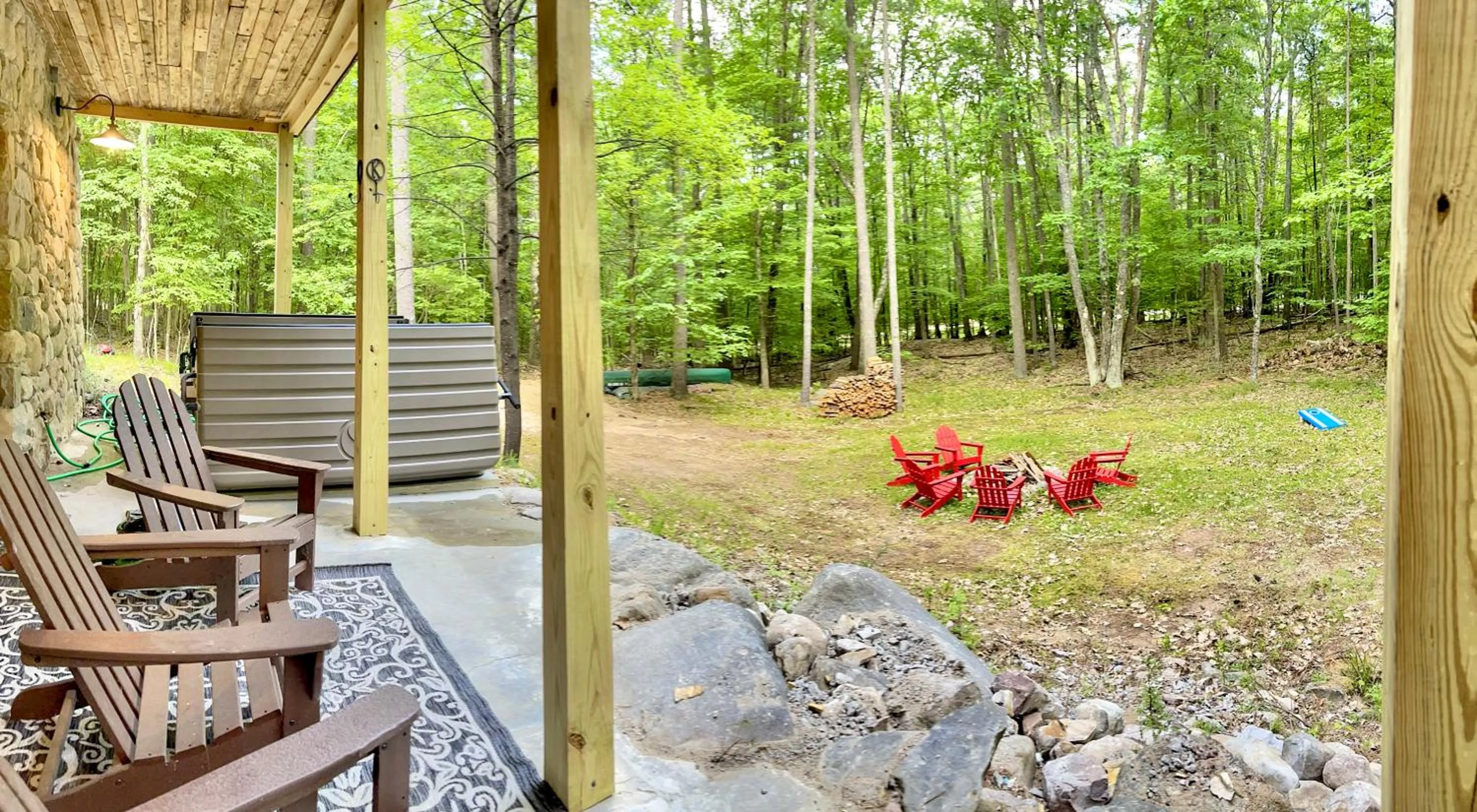 Patio in Adirondack Mountain Cabin with Hot Tub, Near Whiteface, Lake Placid, Fire Pit, Game Rm