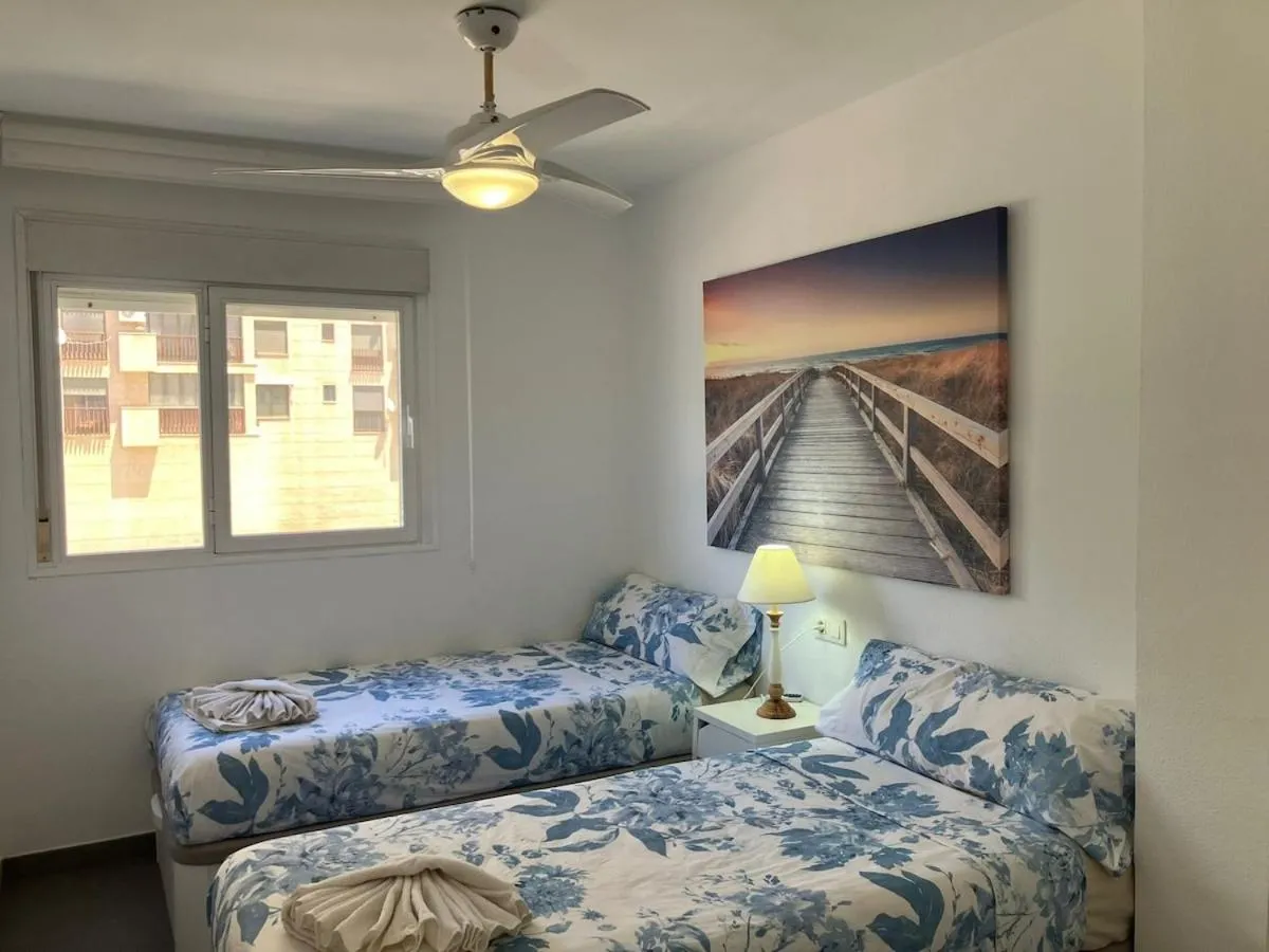 Bed in Seaside Apartment Retreat