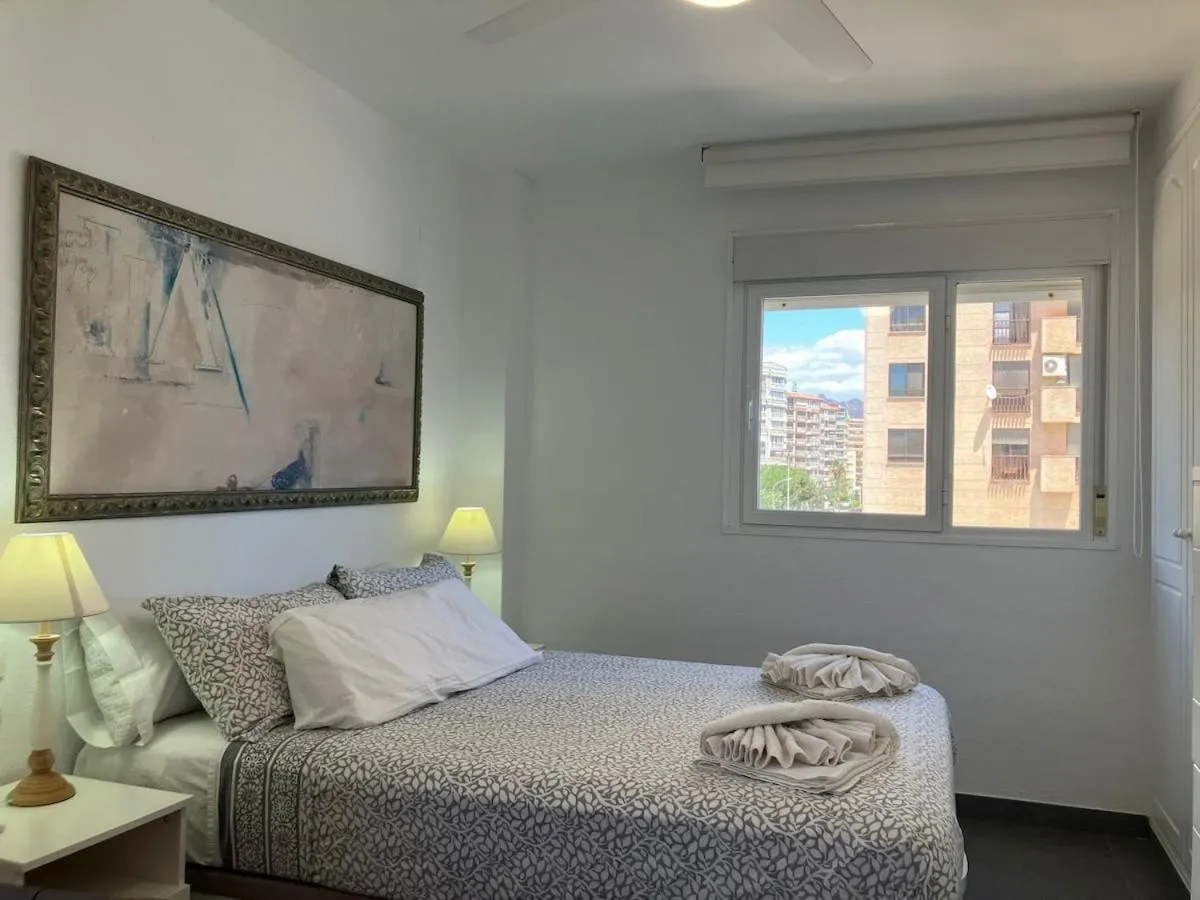 Bed in Seaside Apartment Retreat