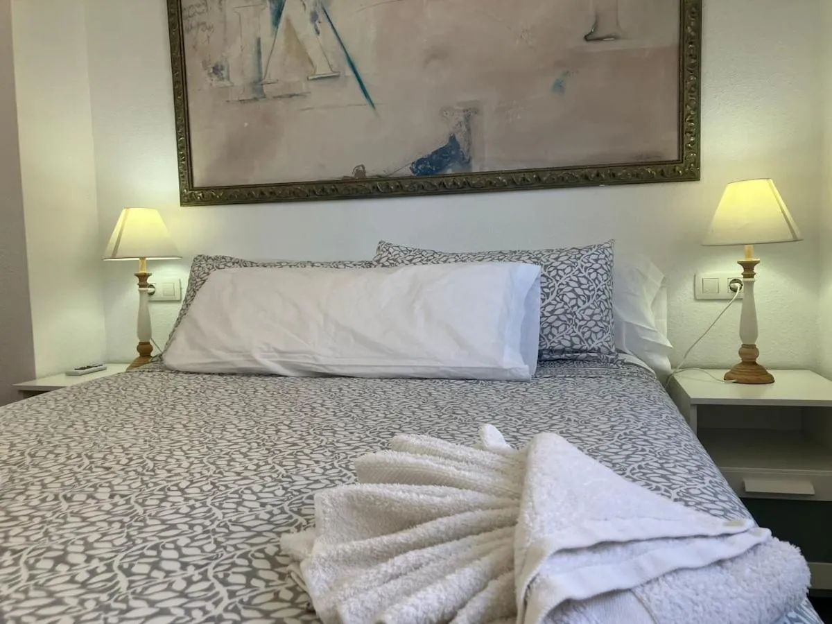 Bed in Seaside Apartment Retreat