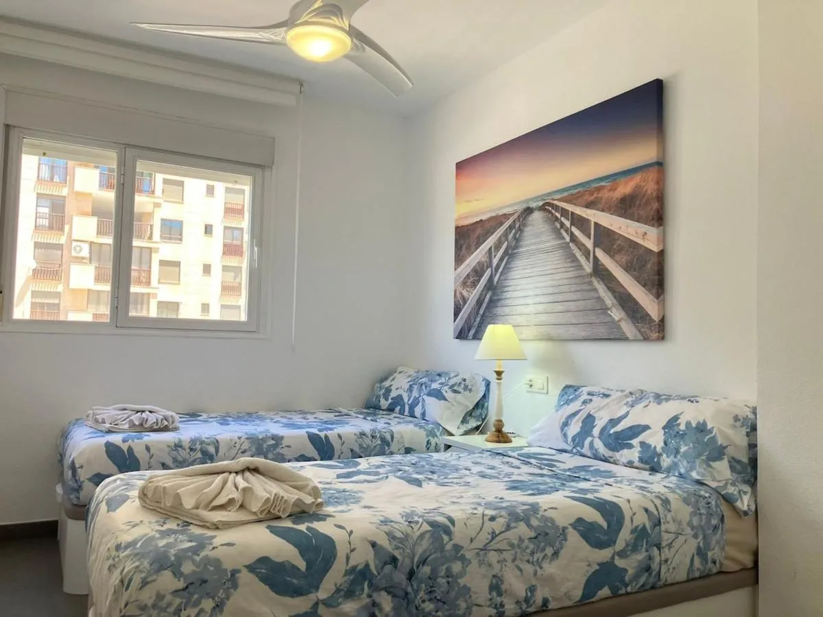 Bed in Seaside Apartment Retreat