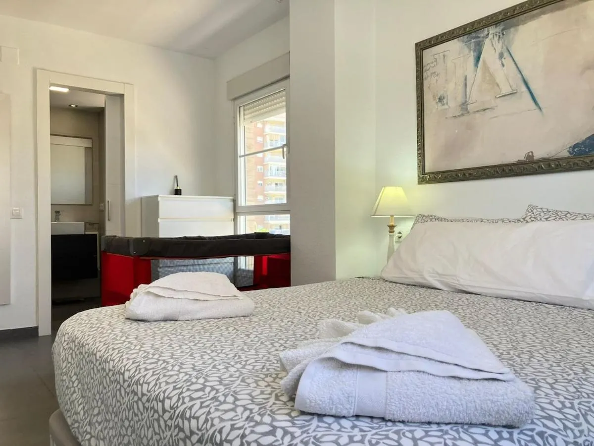 Bed in Seaside Apartment Retreat
