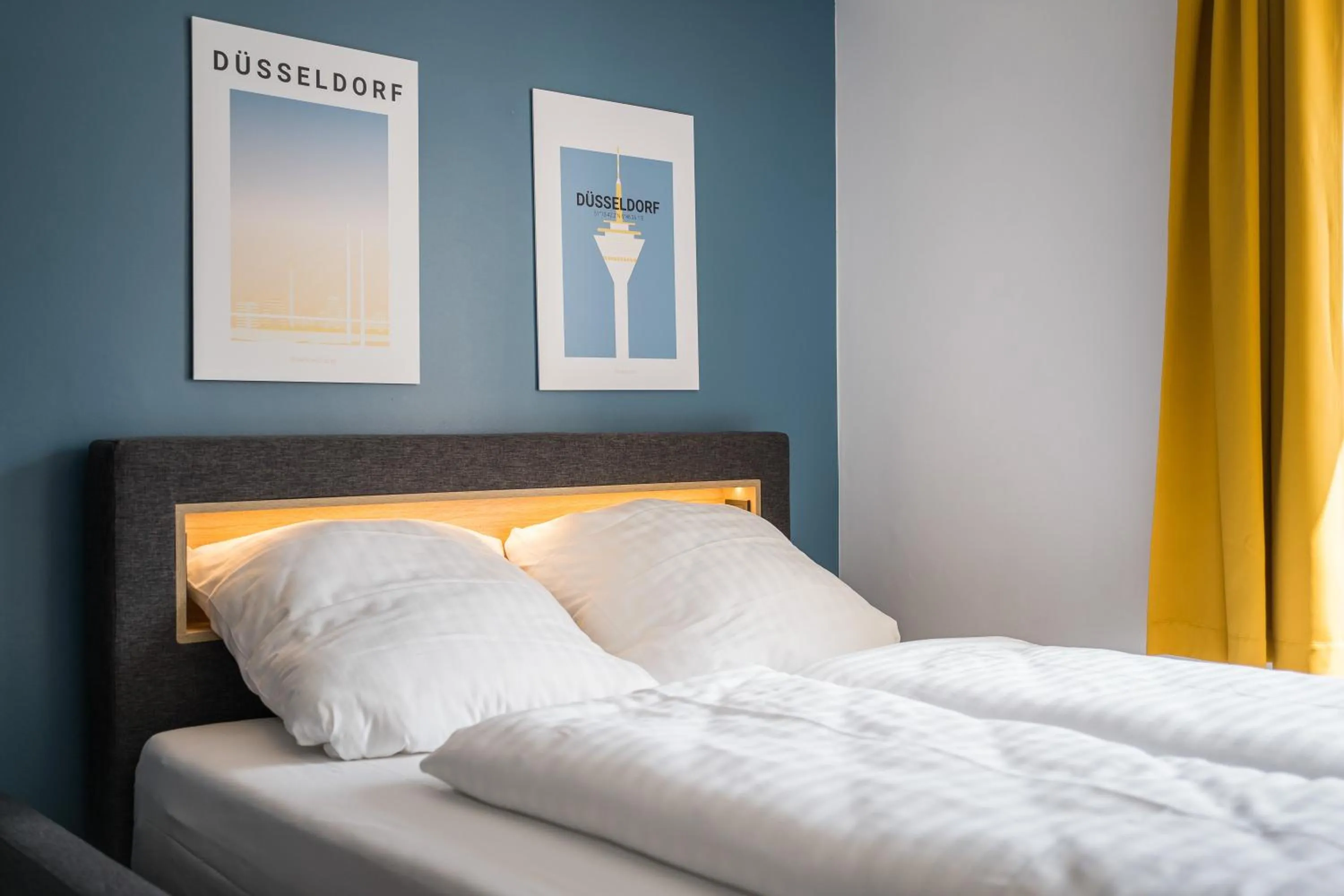 Bed in Antares Apartments