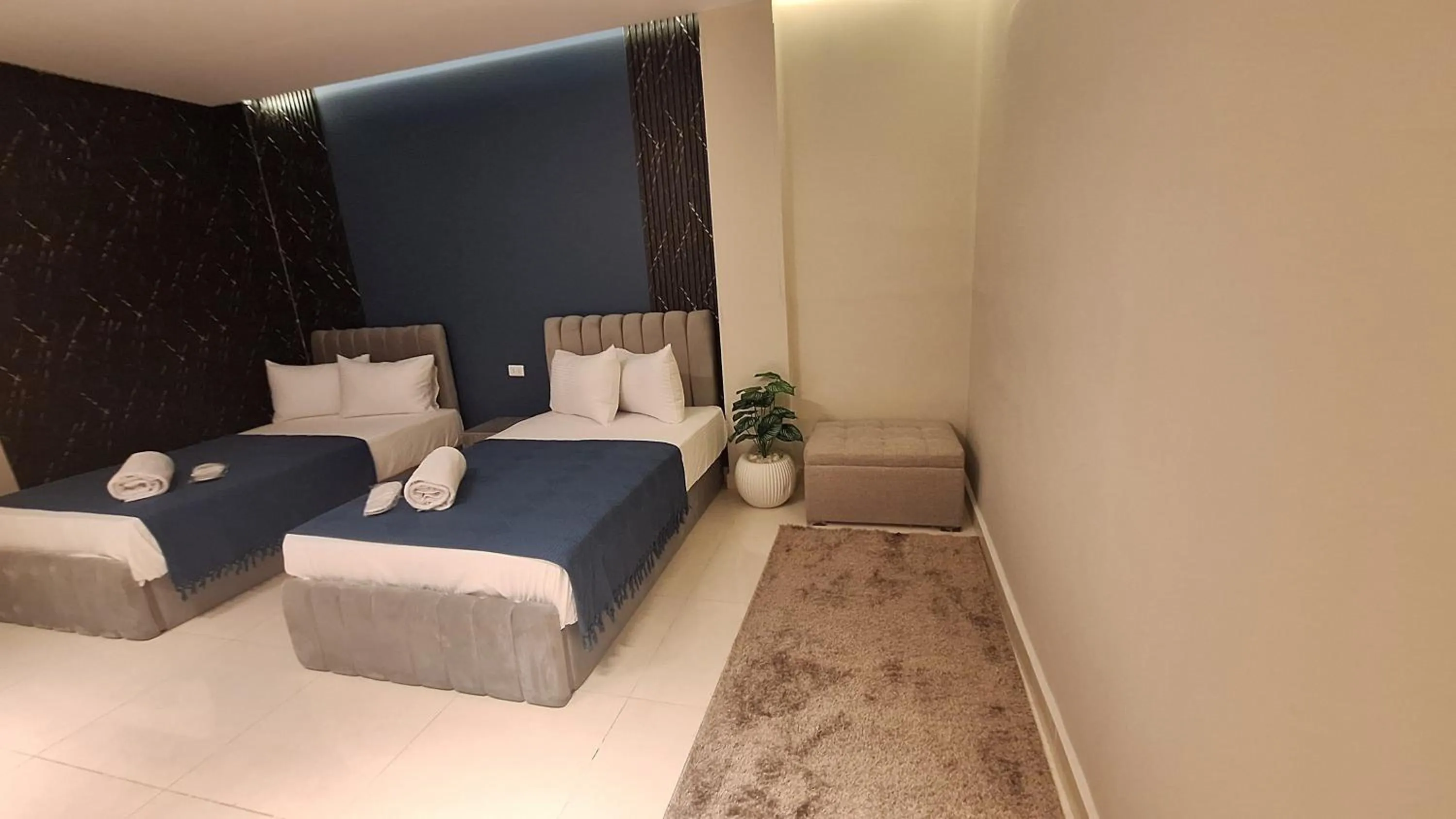 Photo of the whole room, Bed in downtown Family Suites