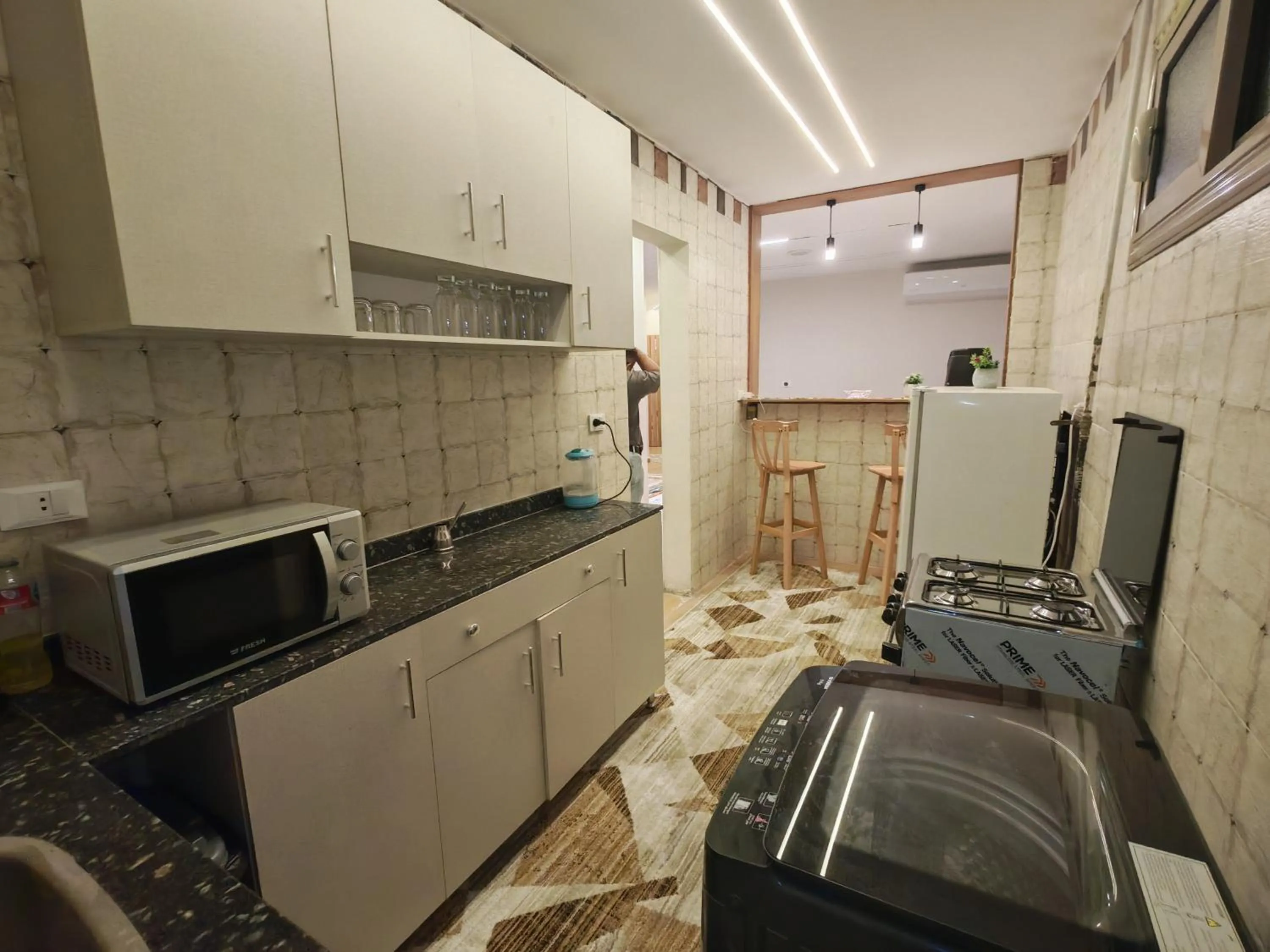 Kitchen or kitchenette in downtown Family Suites