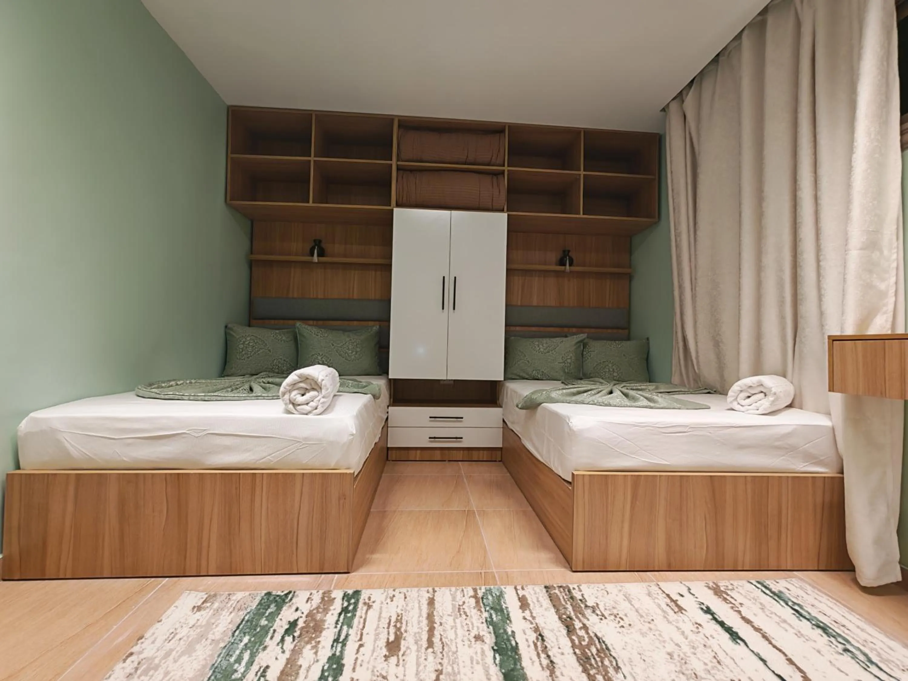 Photo of the whole room, Bed in downtown Family Suites