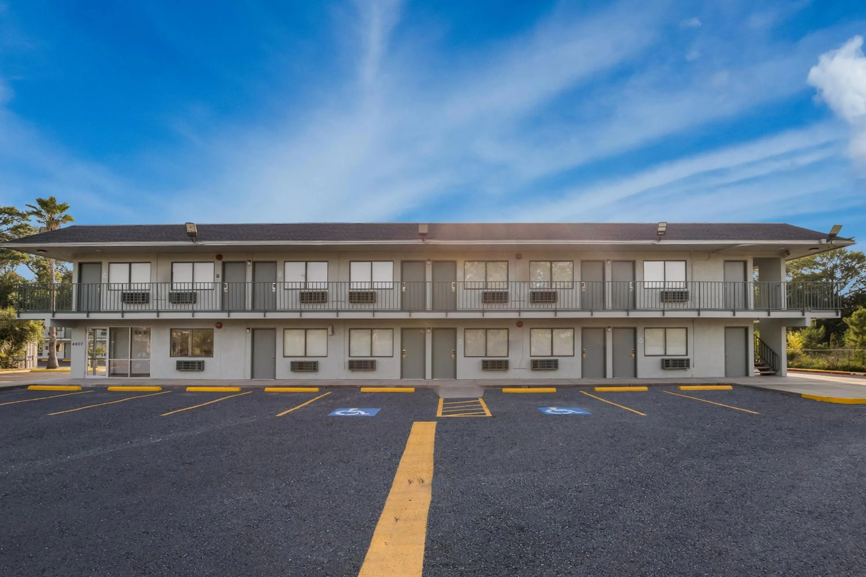 Property building in HomeTowne Studios by Red Roof Orange, TX