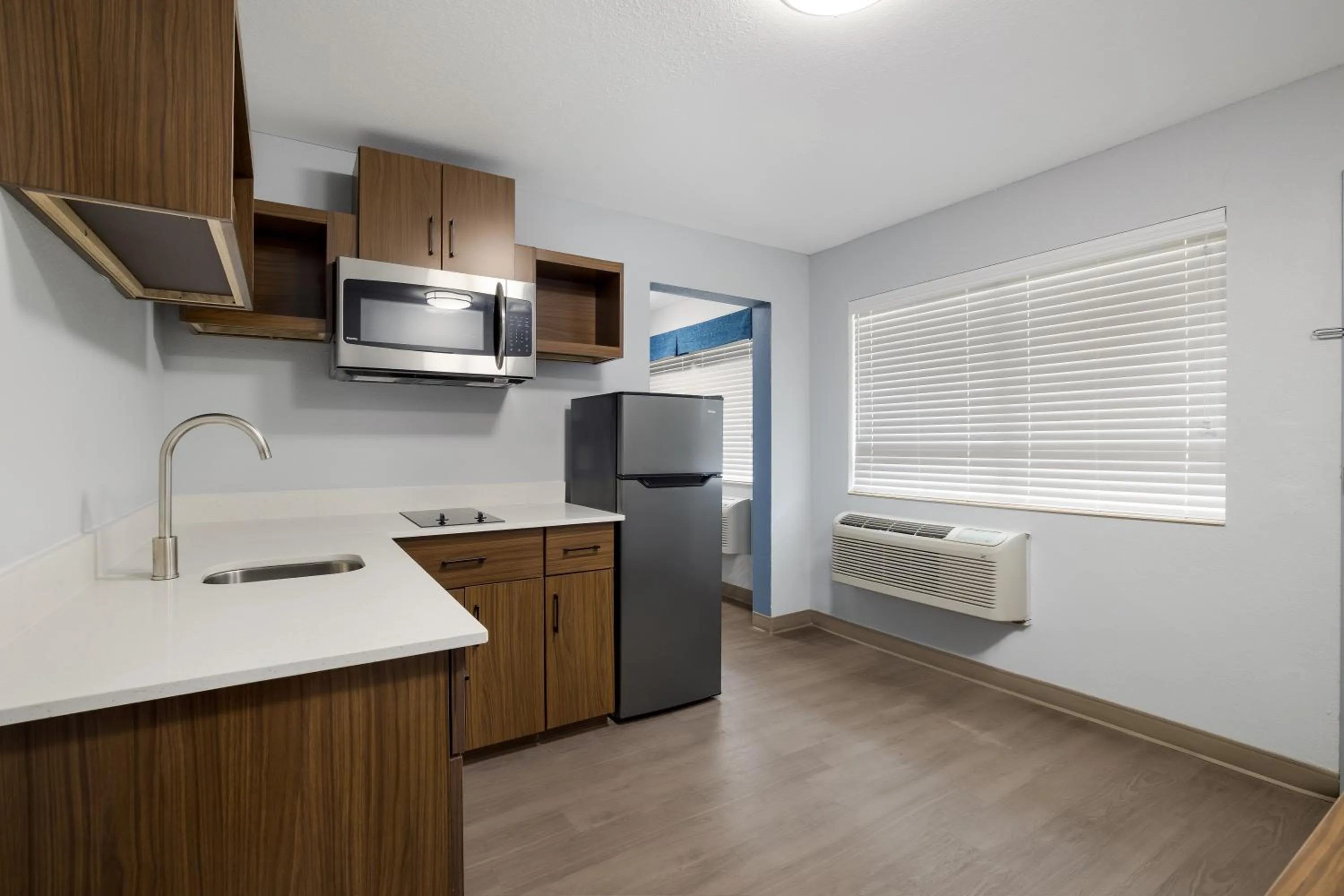 Kitchen or kitchenette in HomeTowne Studios by Red Roof Orange, TX