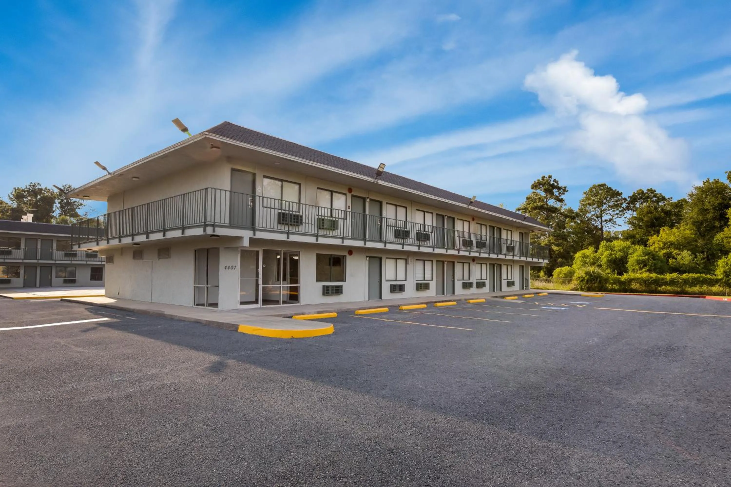 Property building in HomeTowne Studios by Red Roof Orange, TX