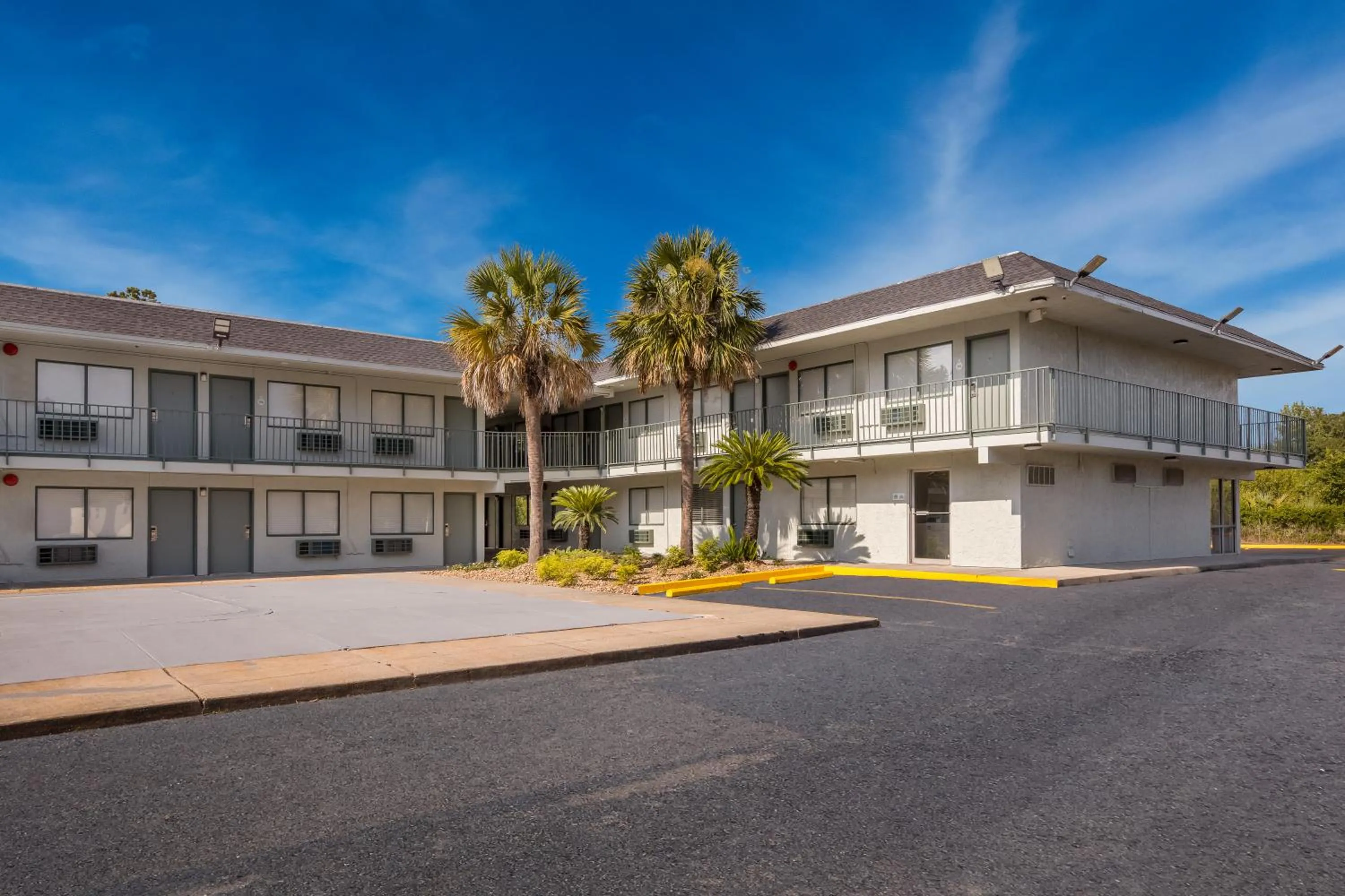 Property building in HomeTowne Studios by Red Roof Orange, TX