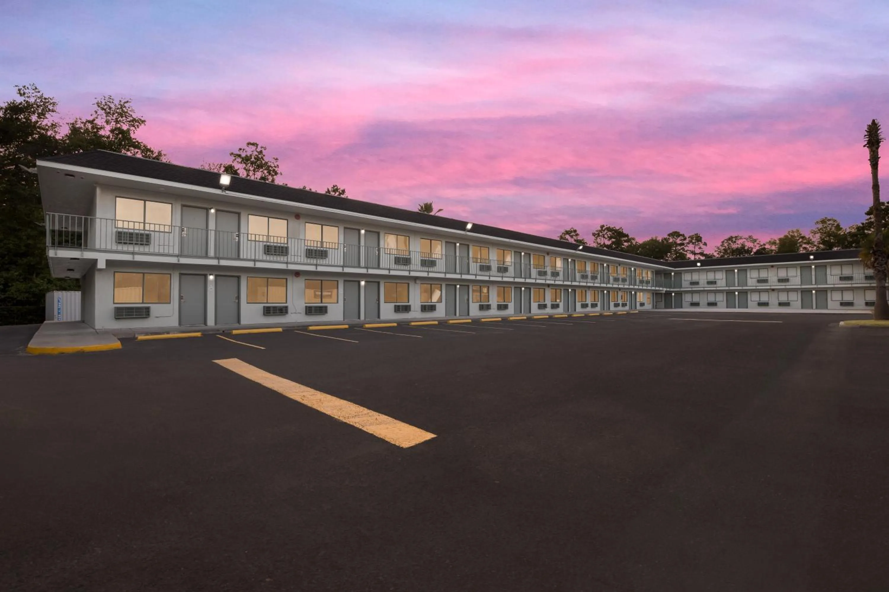 Property building in HomeTowne Studios by Red Roof Orange, TX