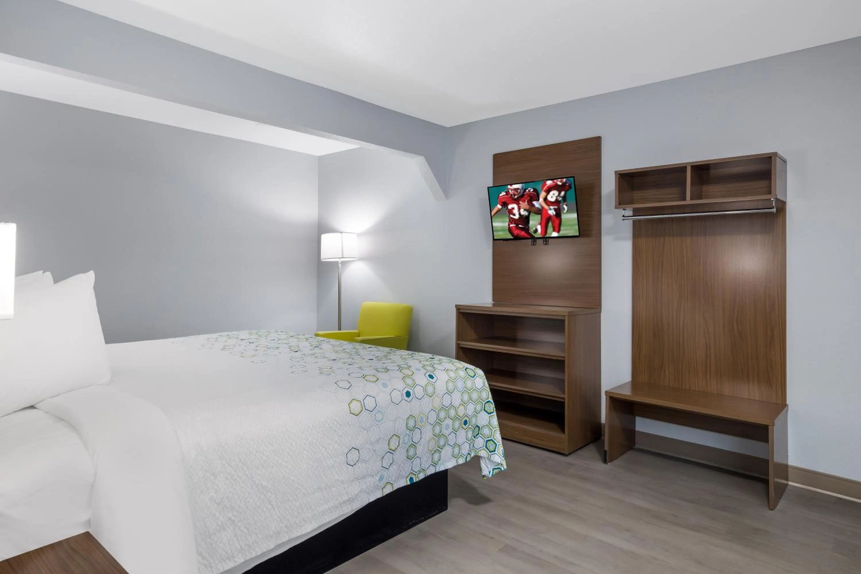 Bed in HomeTowne Studios by Red Roof Orange, TX