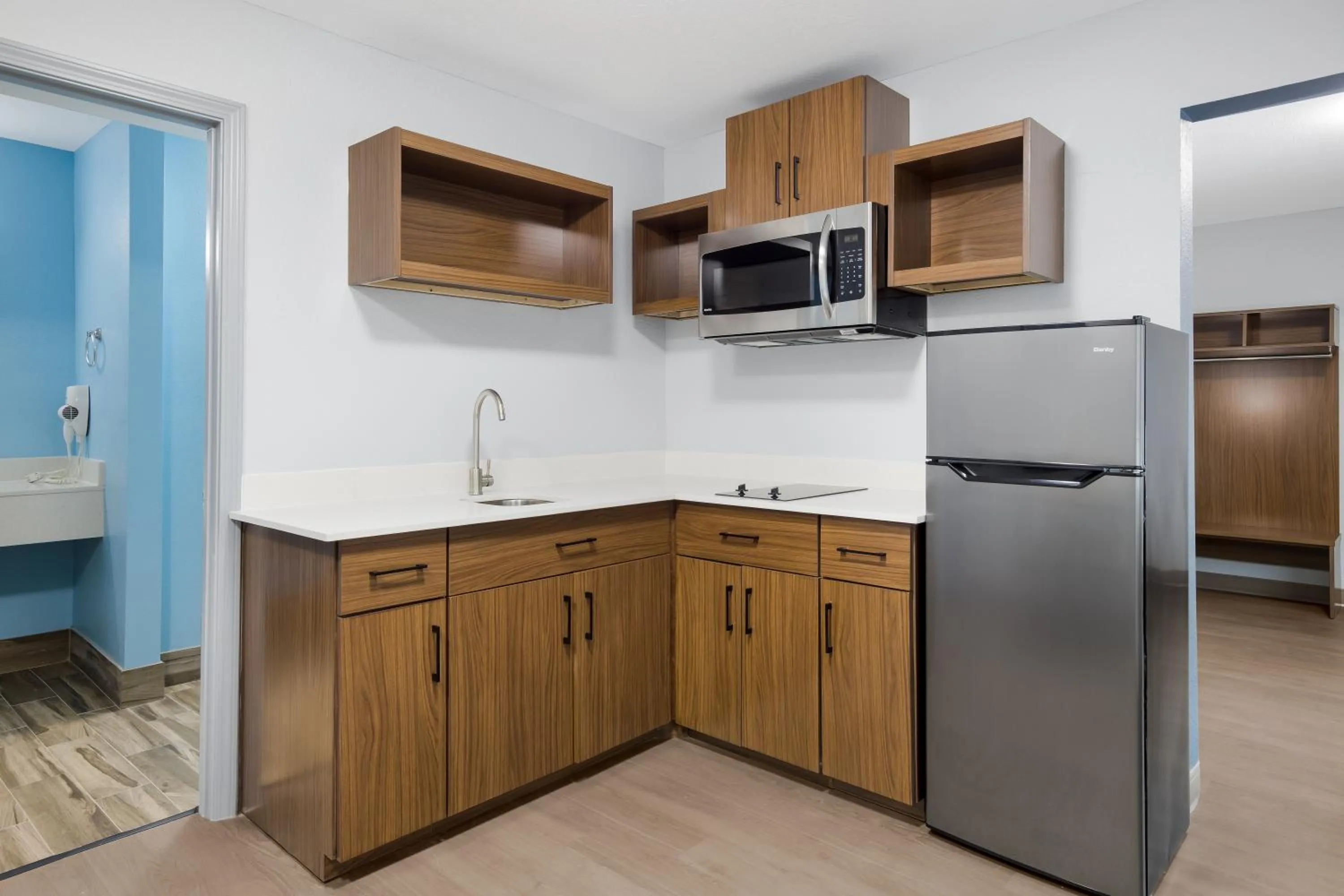 Kitchen or kitchenette in HomeTowne Studios by Red Roof Orange, TX