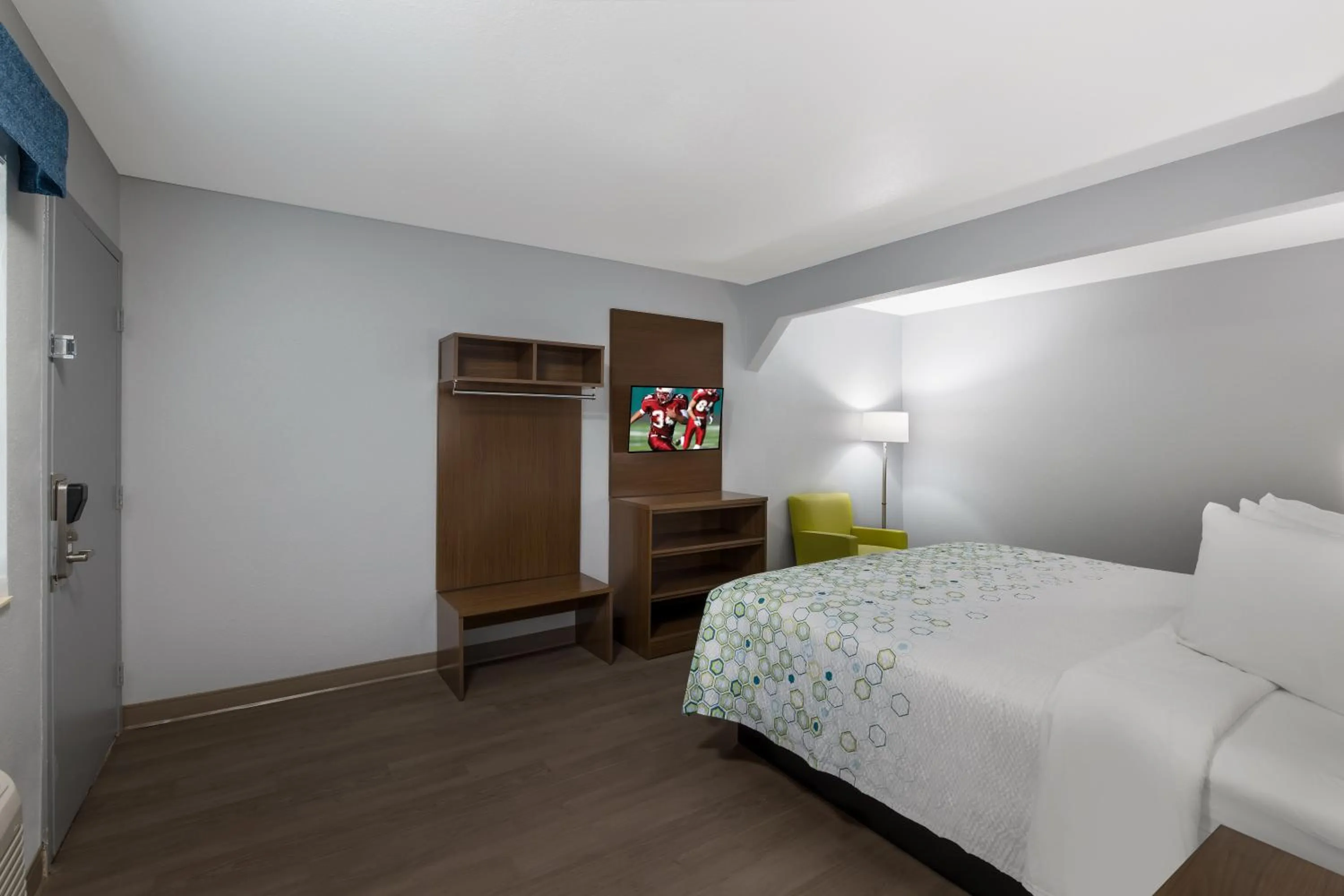 Bed in HomeTowne Studios by Red Roof Orange, TX