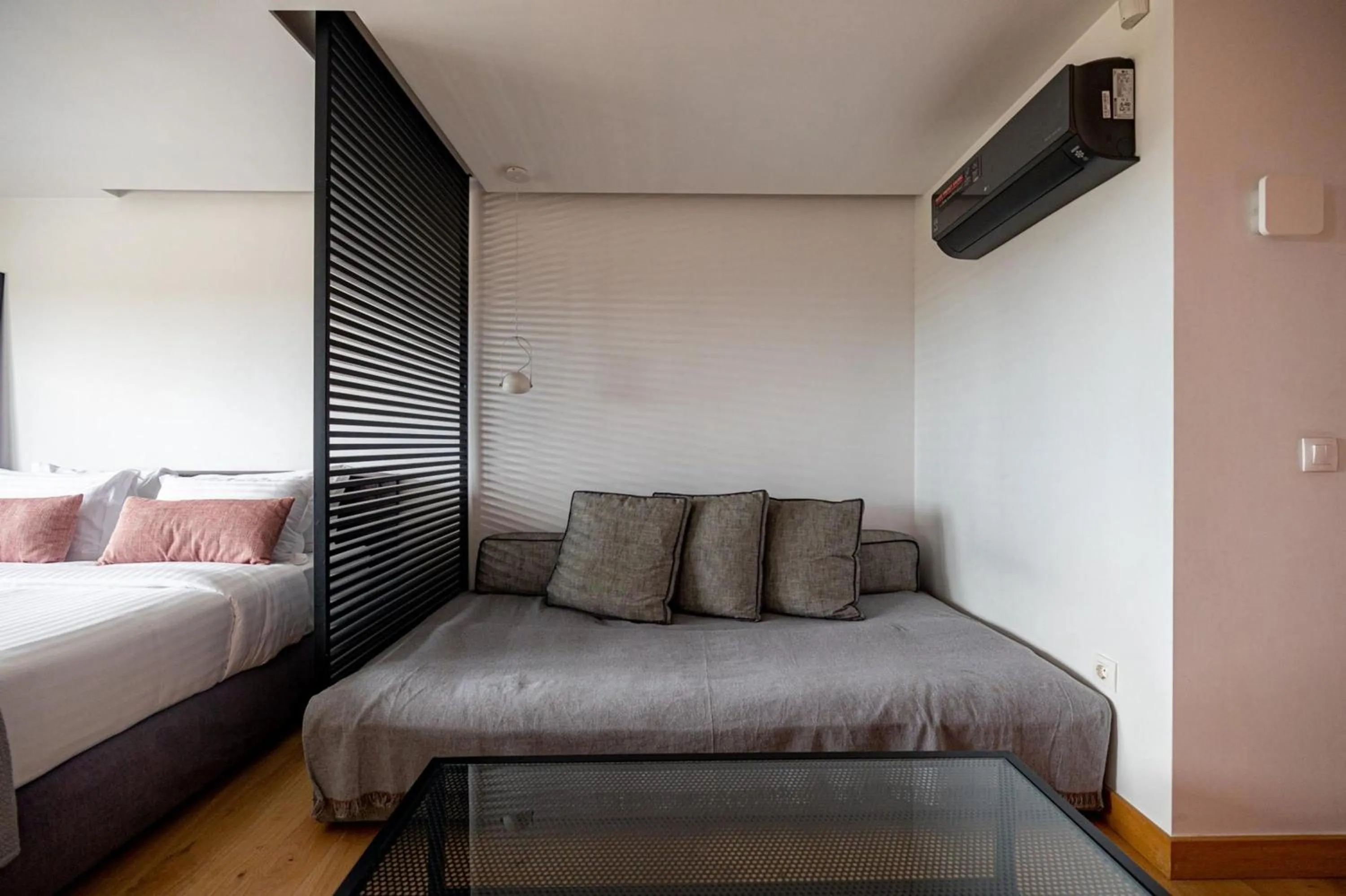 Bed in Earth Boutique Apartments next to Stavros Niarchos