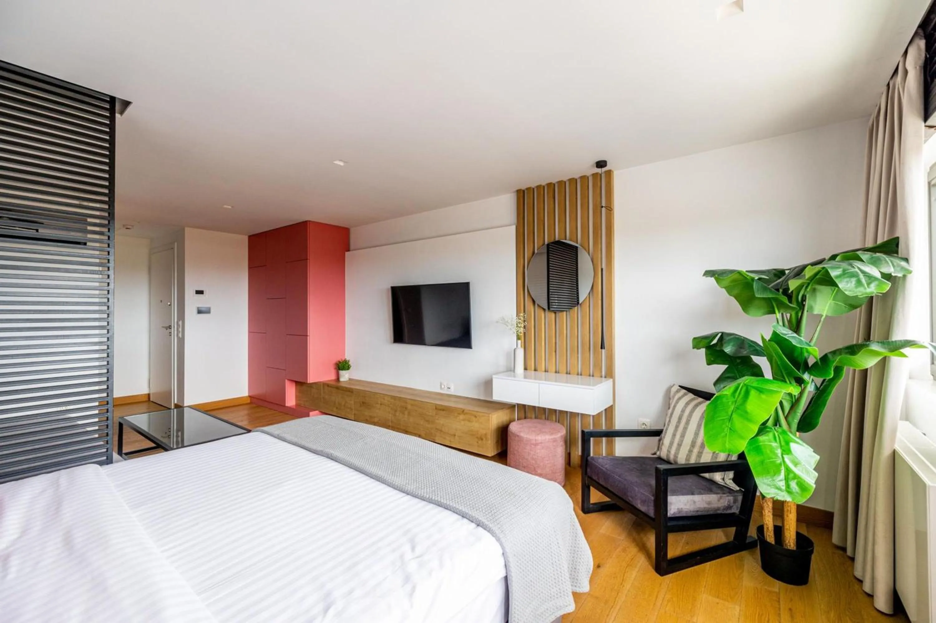 Bed in Earth Boutique Apartments next to Stavros Niarchos