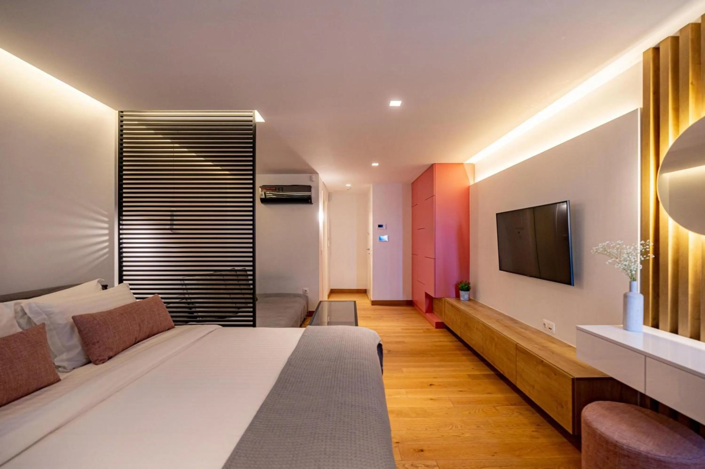 Bed in Earth Boutique Apartments next to Stavros Niarchos