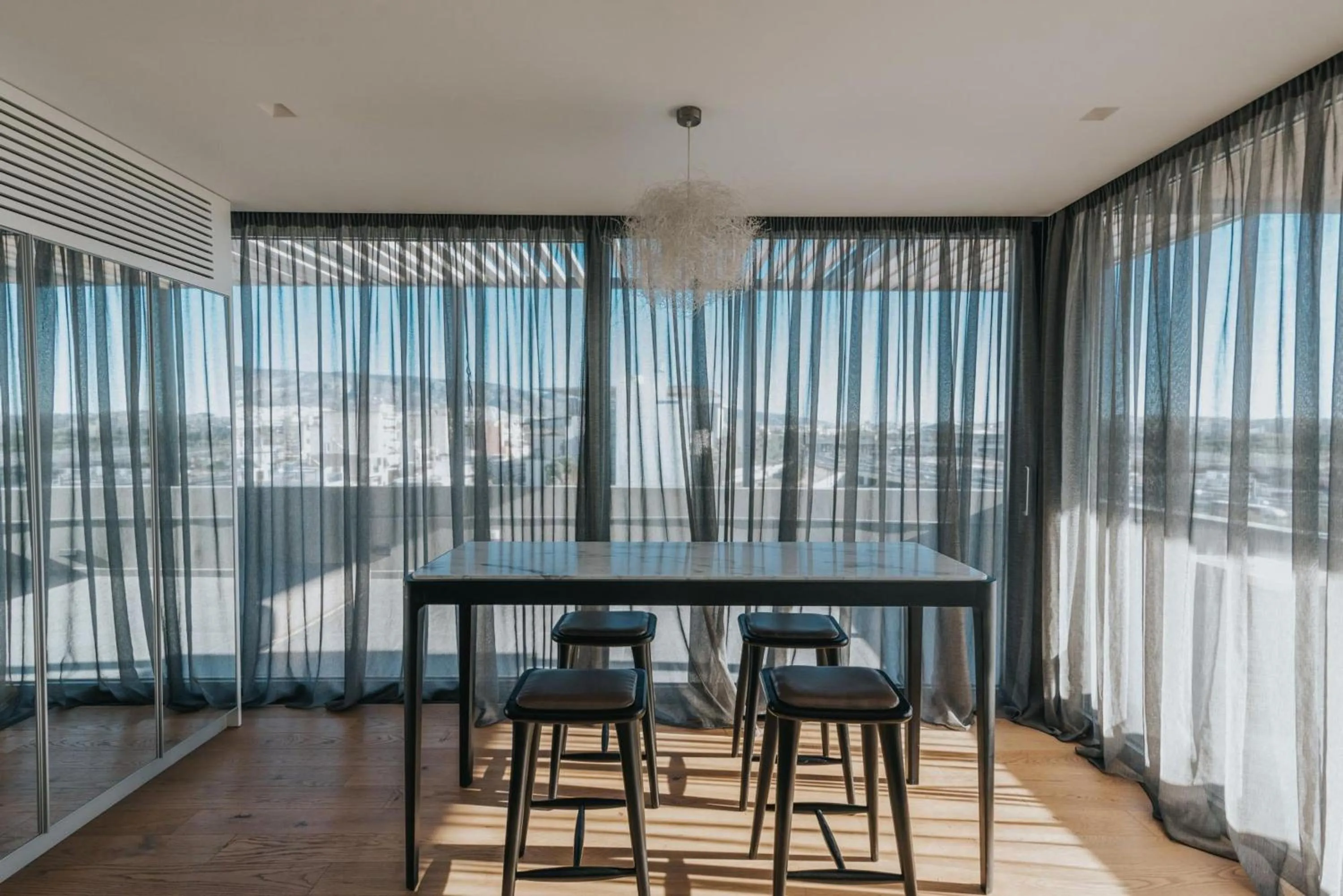 Dining area in Earth Boutique Apartments next to Stavros Niarchos