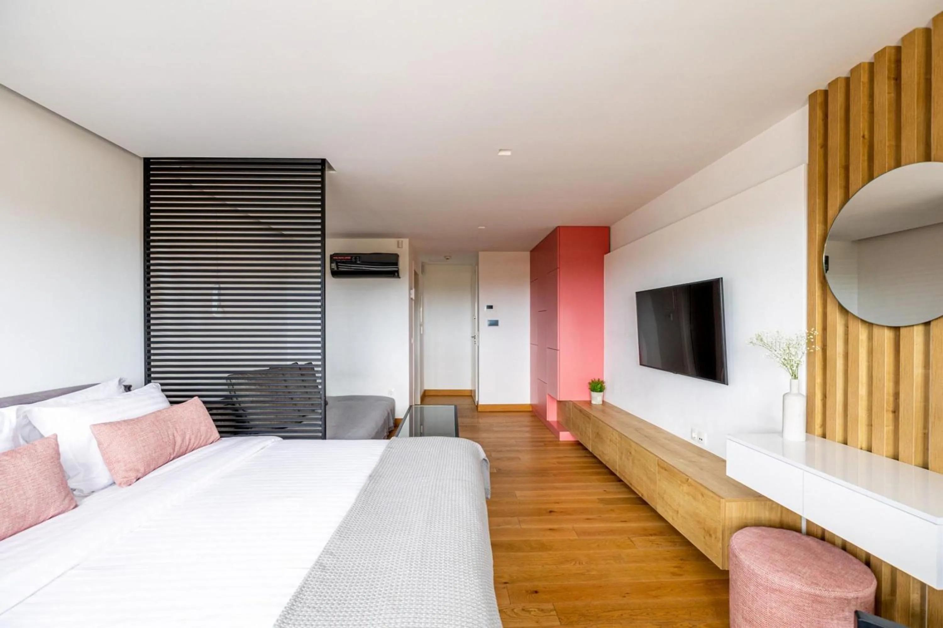 Bed in Earth Boutique Apartments next to Stavros Niarchos