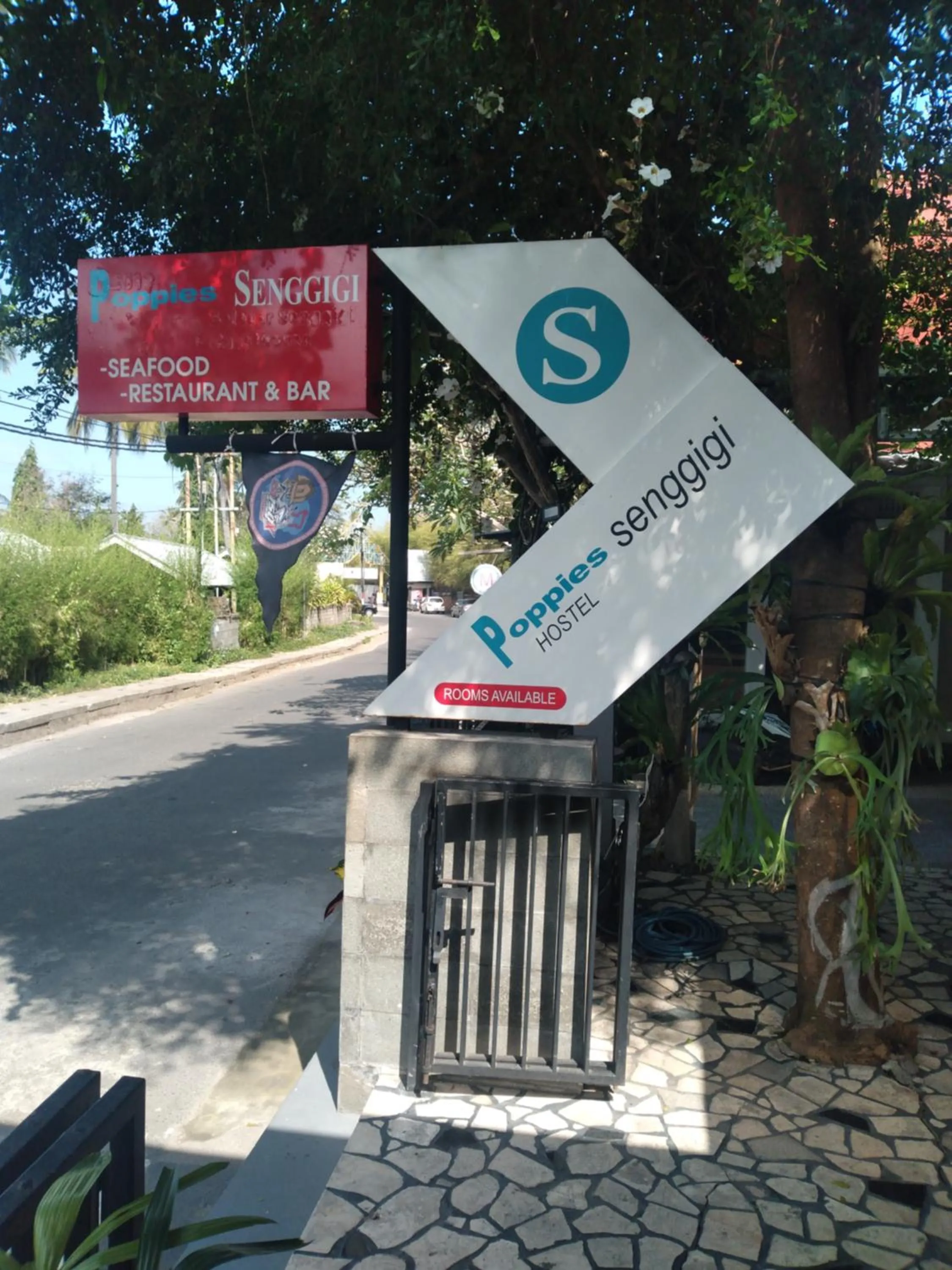 Property logo or sign in Poppies Senggigi Hostel