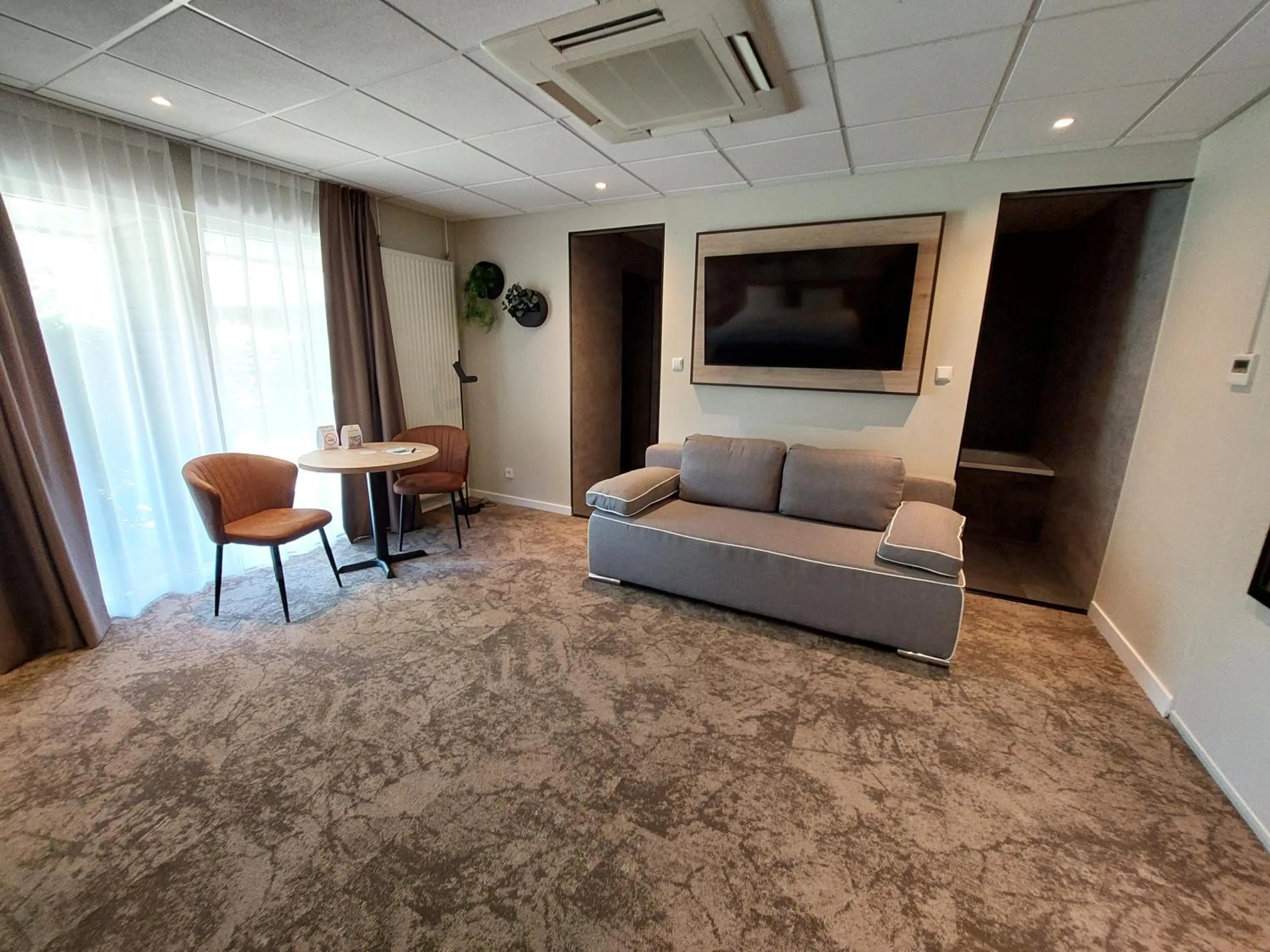 Seating area in Fletcher Hotel-Restaurant Mooi Veluwe