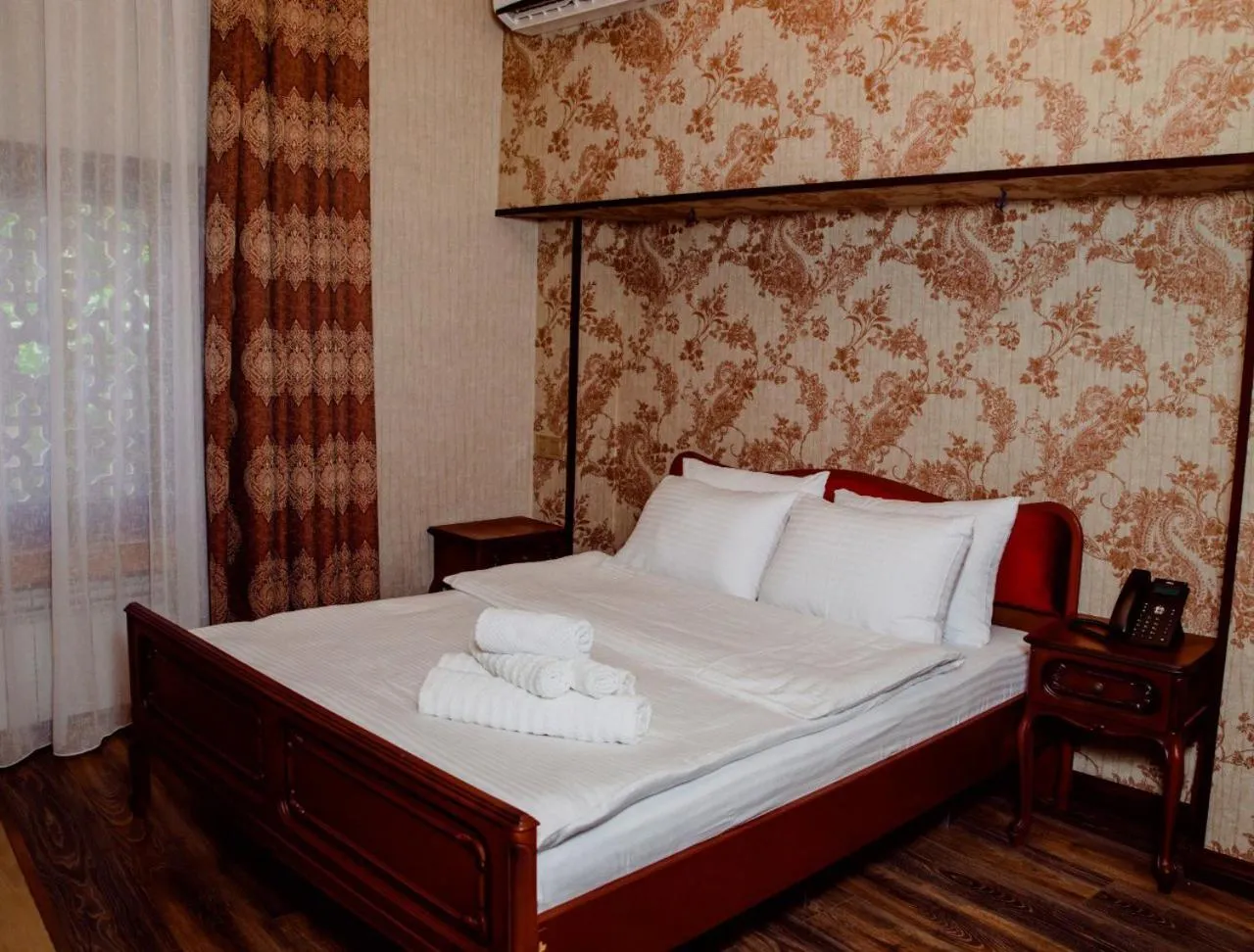 Bed in Royal Antique Boutique Hotel